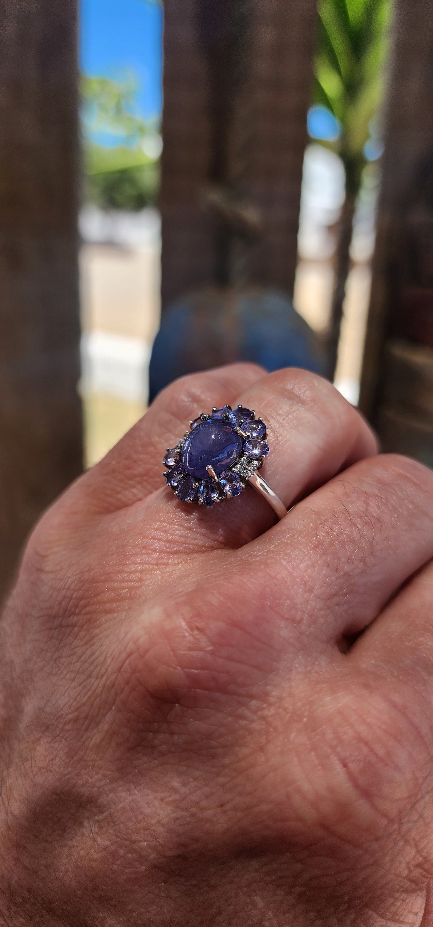 WOW… she’s magic — Tanzanite Halo / Cluster Dress Ring in Sterling Silver.