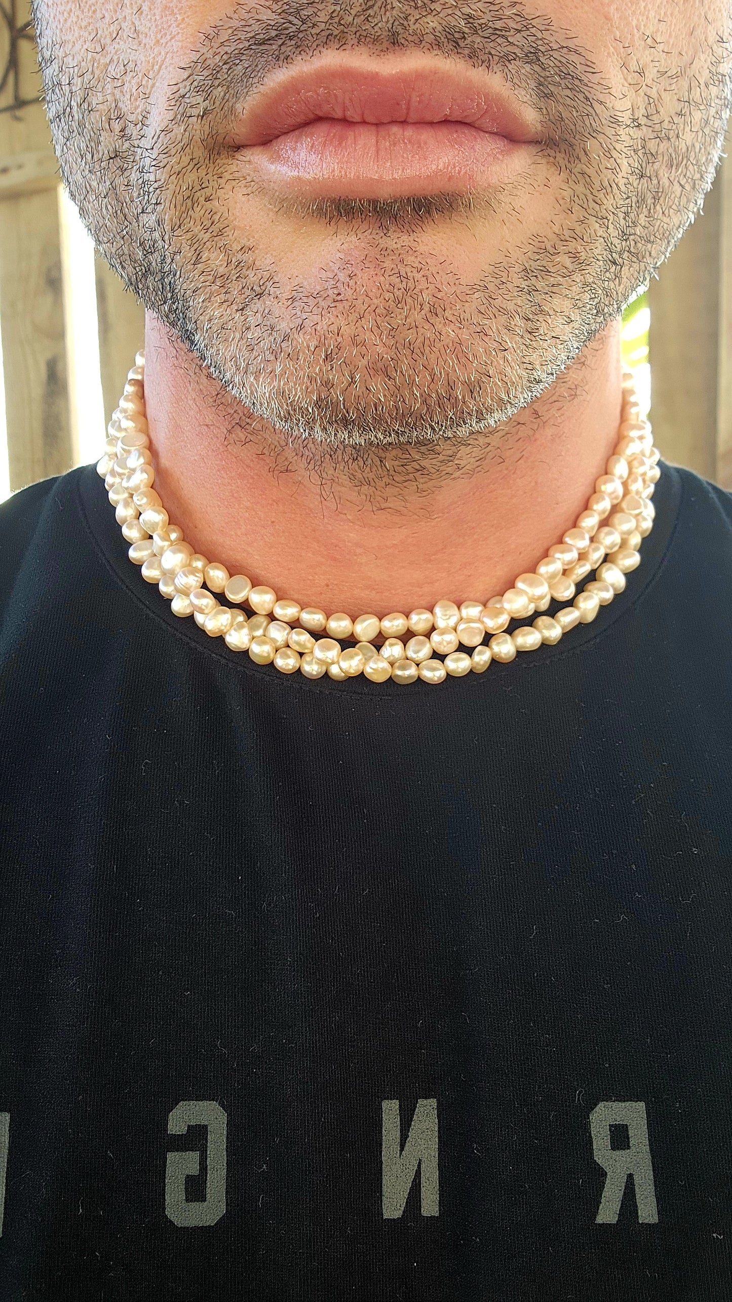 Elegant and seriously luxurious — this handmade three-strand freshwater pearl necklace is a classical beauty with a modern edge.