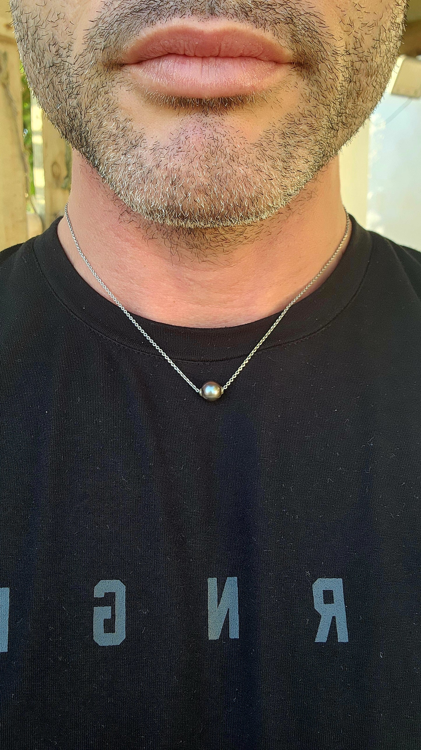 This sterling silver & black peacock cultured pearl necklace is a timeless little talisman for both the ladies AND the boys.