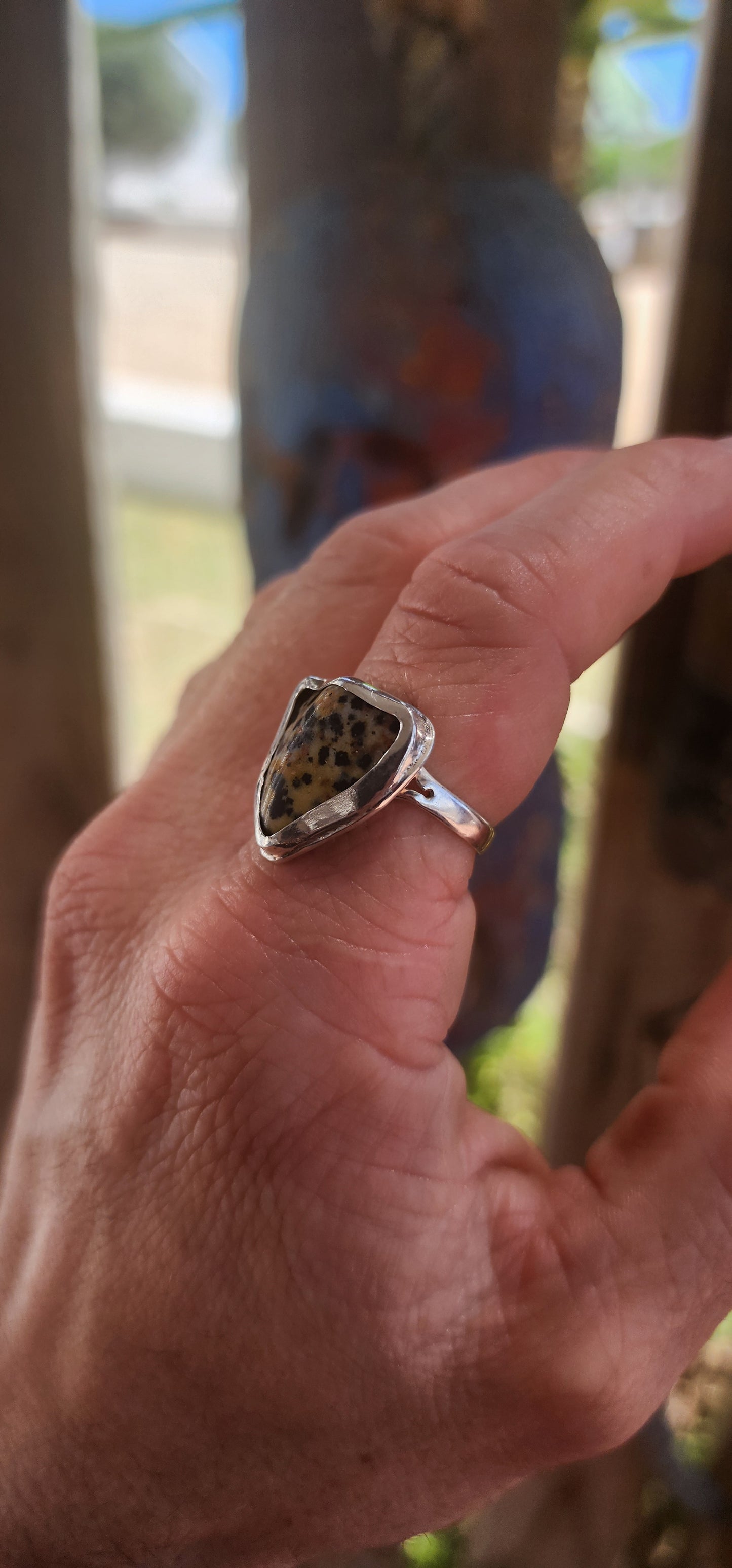 A striking artisan-made sterling silver dress ring, designed around a beautifully irregular, organically shaped Dalmatian Jasper cabochon.