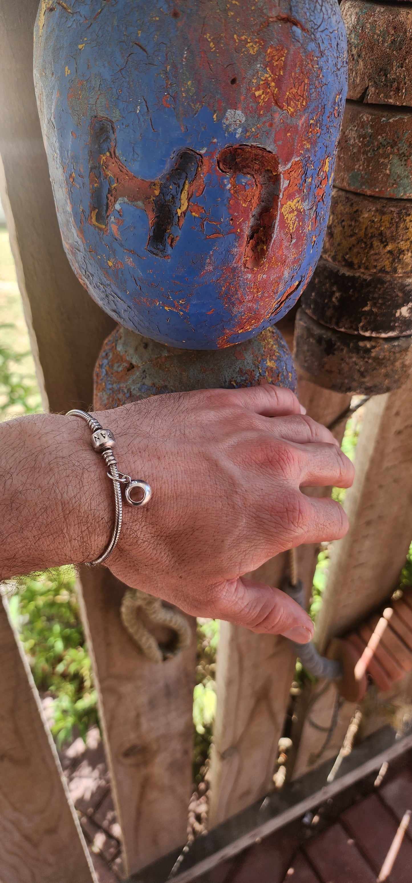 A beautifully wearable Pandora sterling silver snake chain bracelet, paired with a luminous prasiolite (green amethyst) dangle charm.