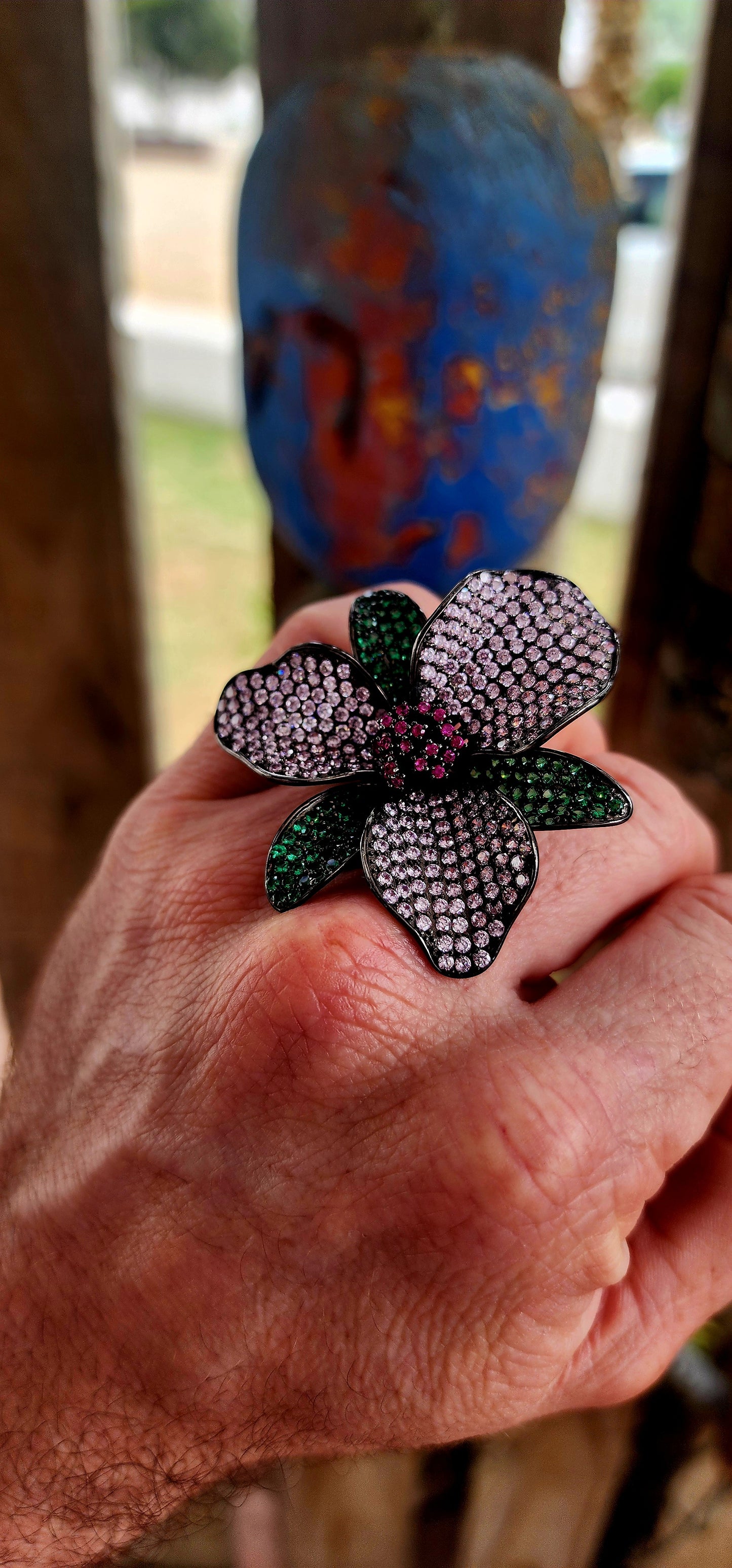 A magical, three-dimensional flower brought to life in rich blackened sterling silver — giving it that moody, gothic, almost midnight-garden energy.