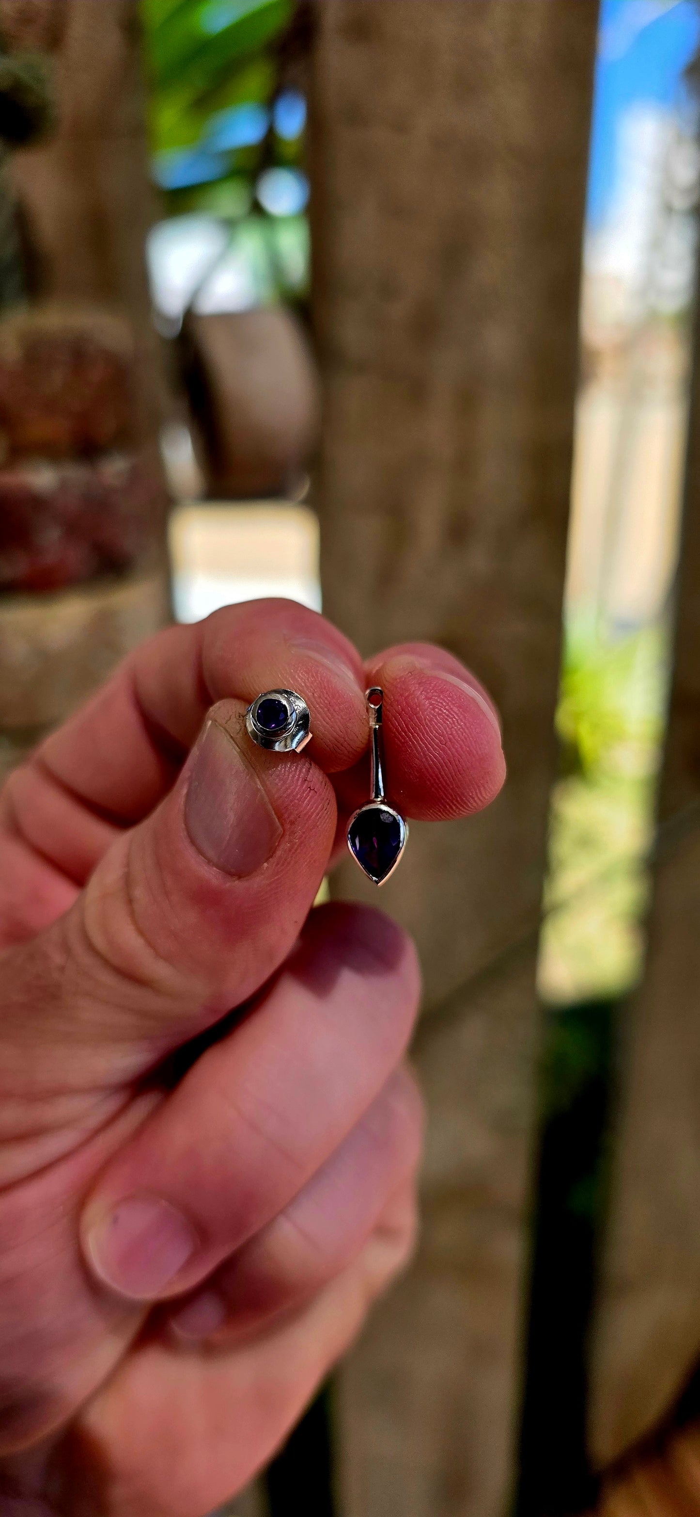 This beautiful pair of modernist-style drop earrings is crafted in solid sterling silver, featuring a sleek geometric design that perfectly showcases the rich colour of amethyst gemstones.