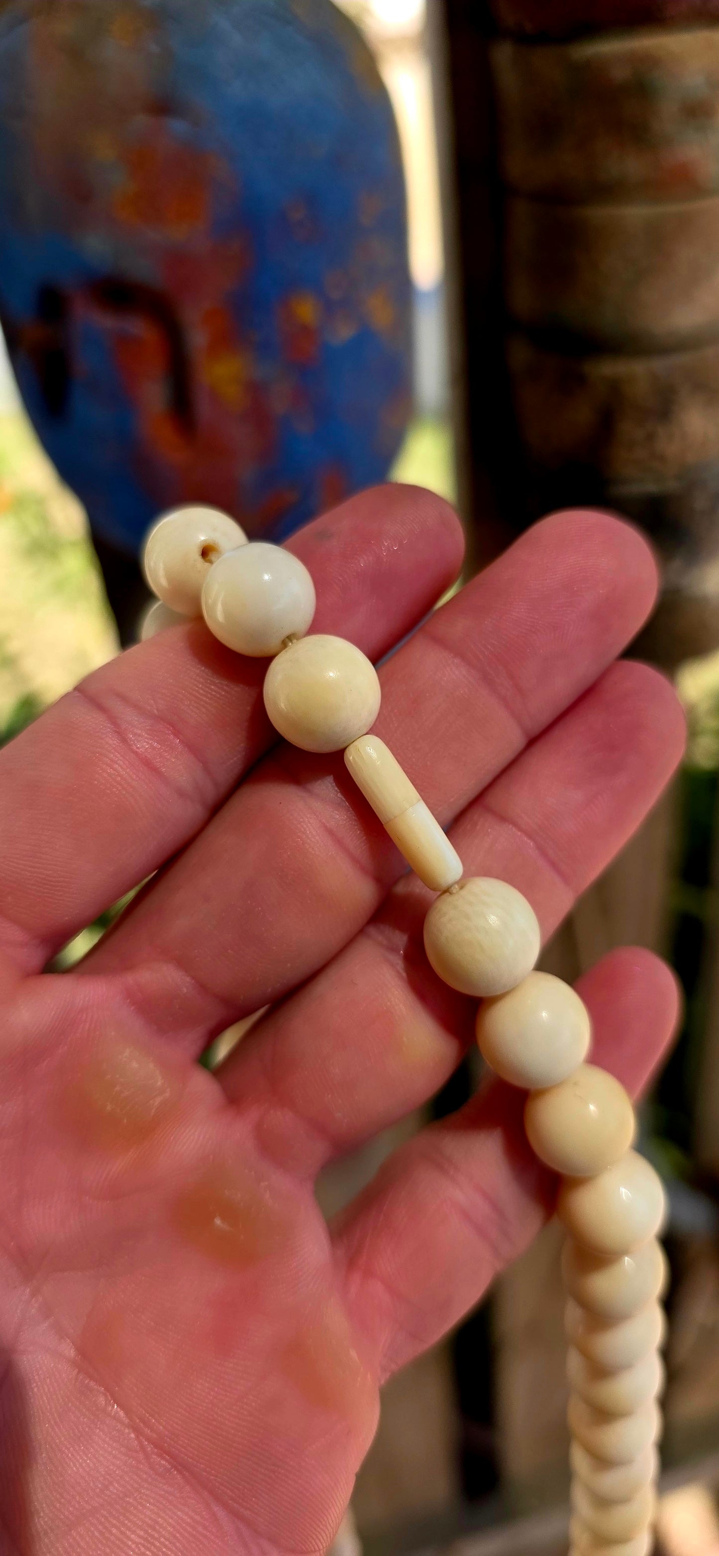 This beautiful antique necklace features a generous strand of perfectly round hand-carved pre-ban ivory beads, forming a timeless and sophisticated piece with remarkable presence.