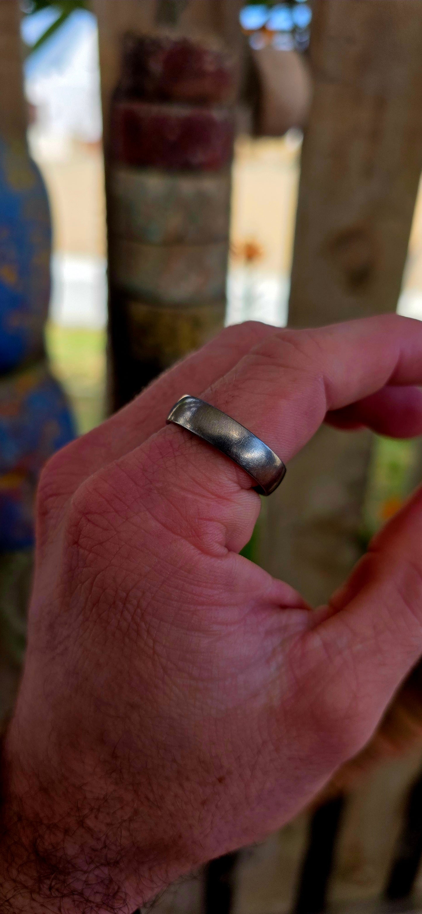 A sleek, mens titanium band ring by renowned South African luxury jeweller Arthur Kaplan — the kind of piece that leans into quiet confidence and everyday power.