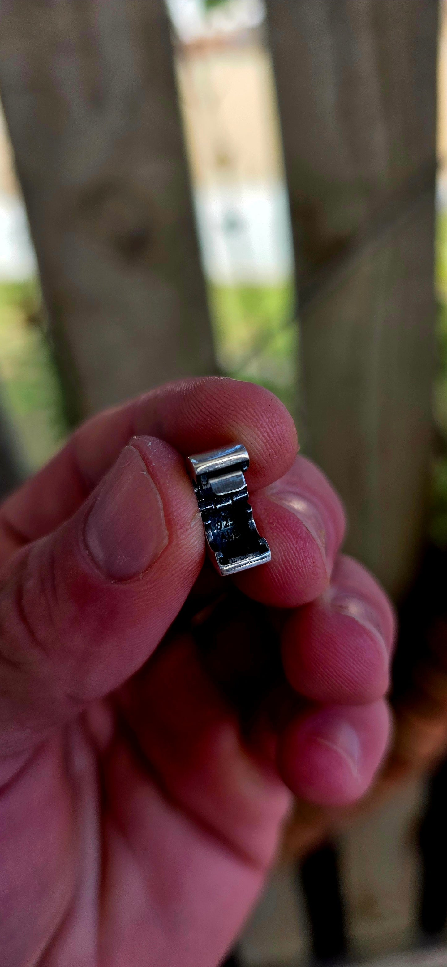 A sleek and understated Pandora sterling silver clip charm, crafted in a smooth, polished finish — part of their retired collection.