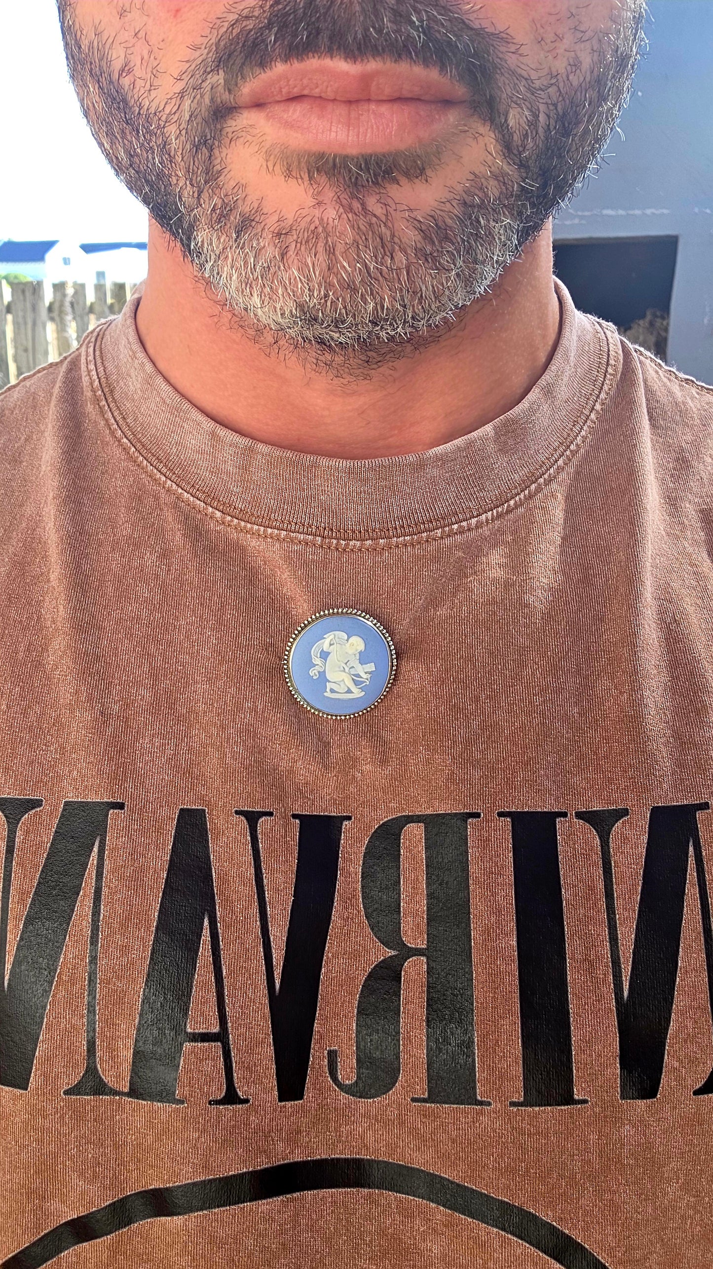 A beautiful vintage sterling silver and Wedgwood jasperware brooch, featuring a classic baby blue jasperware panel adorned with a finely detailed white embossed cherub.