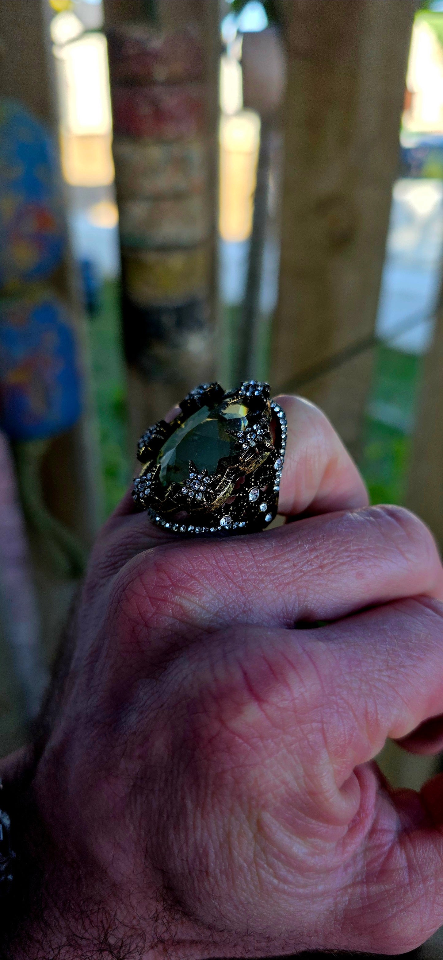 Marvelous oversized Victorian Revival costume dress ring crafted in richly antiqued brass, overflowing with old-world gothic glamour and theatrical sparkle.