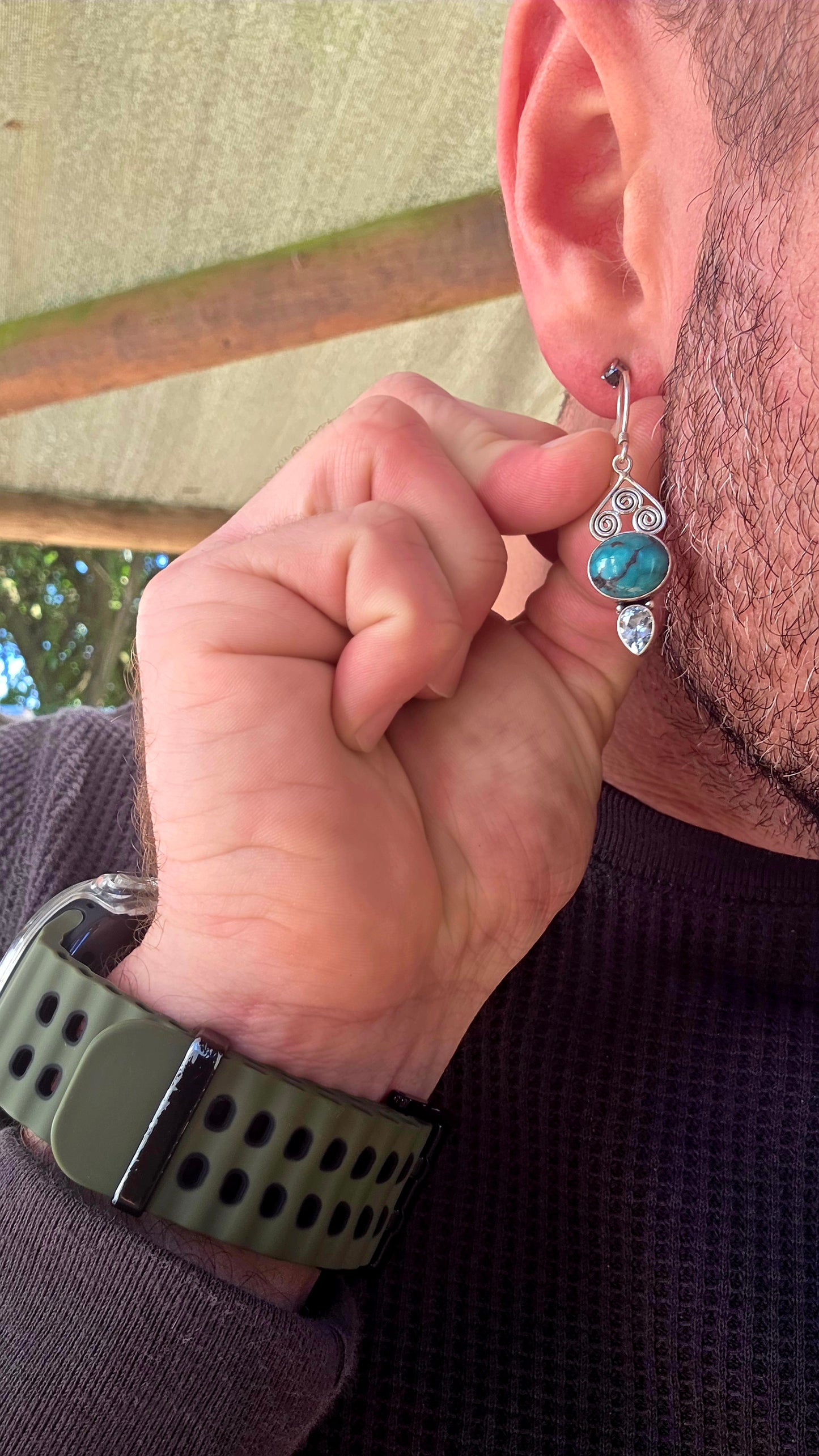 Crafted in sterling silver, the earrings feature beautiful tube-set oval turquoise cabochons displaying those dreamy natural black matrix patterns that make every turquoise stone completely unique .
