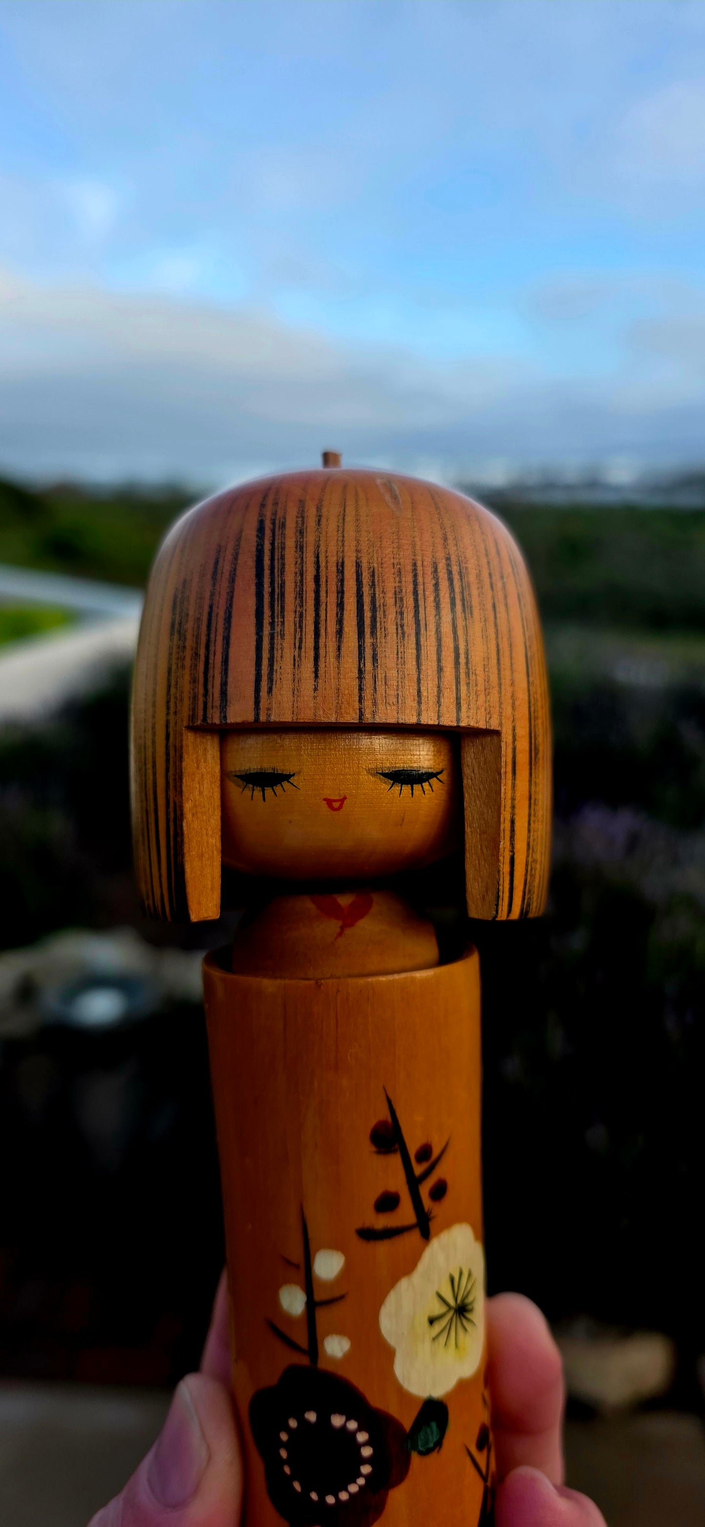 A wonderfully elegant and highly collectible vintage Japanese Kokeshi doll dating to the 1950s.
