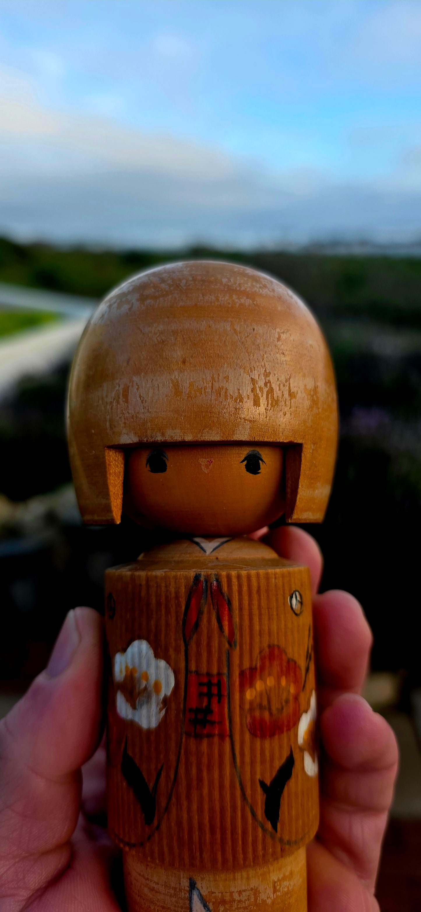 A delightful and highly collectible vintage Japanese Kokeshi doll dating to the 1950s.