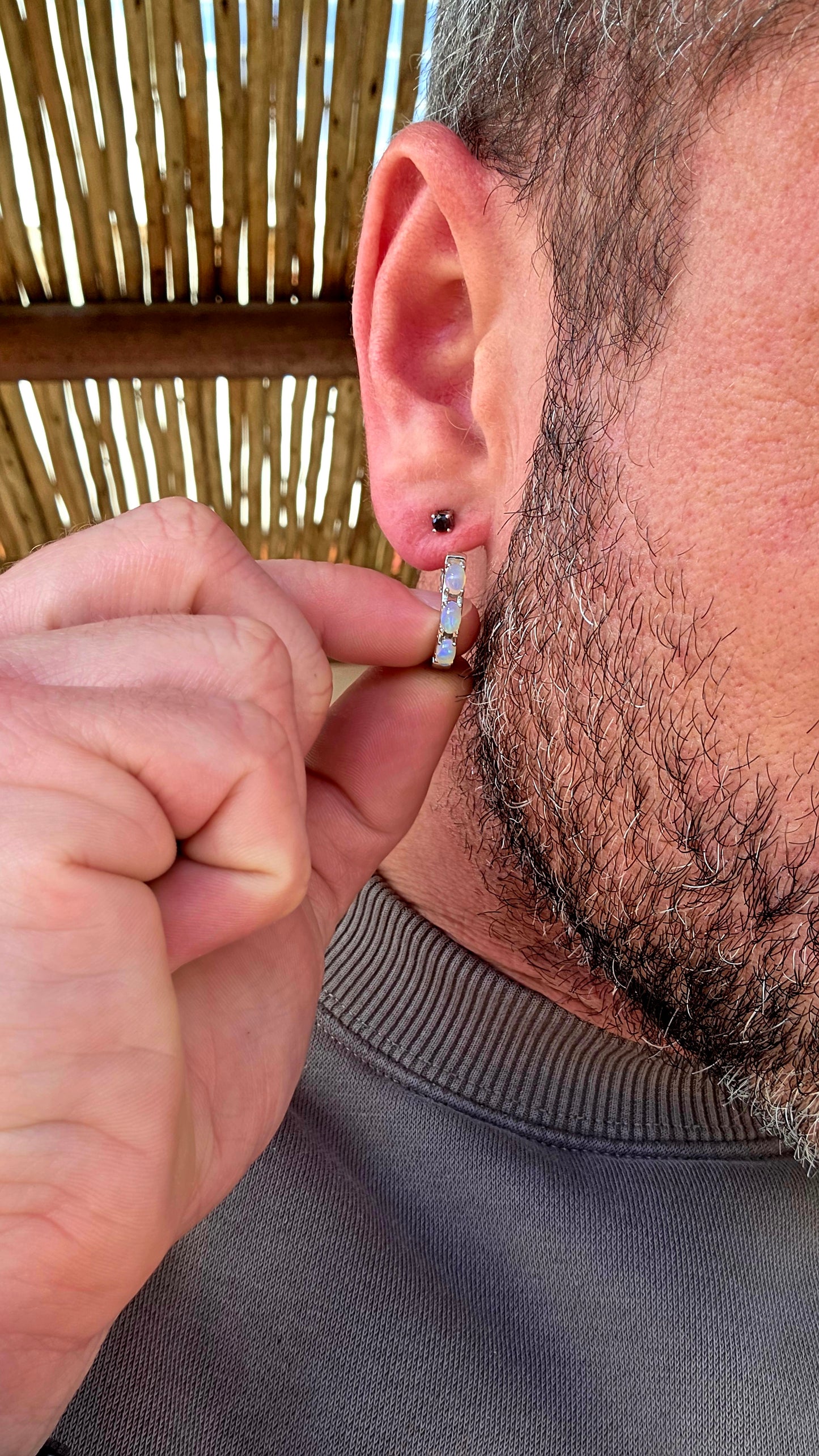 These sterling silver Ethiopian opal huggie earrings are pure magic... extremely elegant with a mesmerising display of colour that changes with every movement.