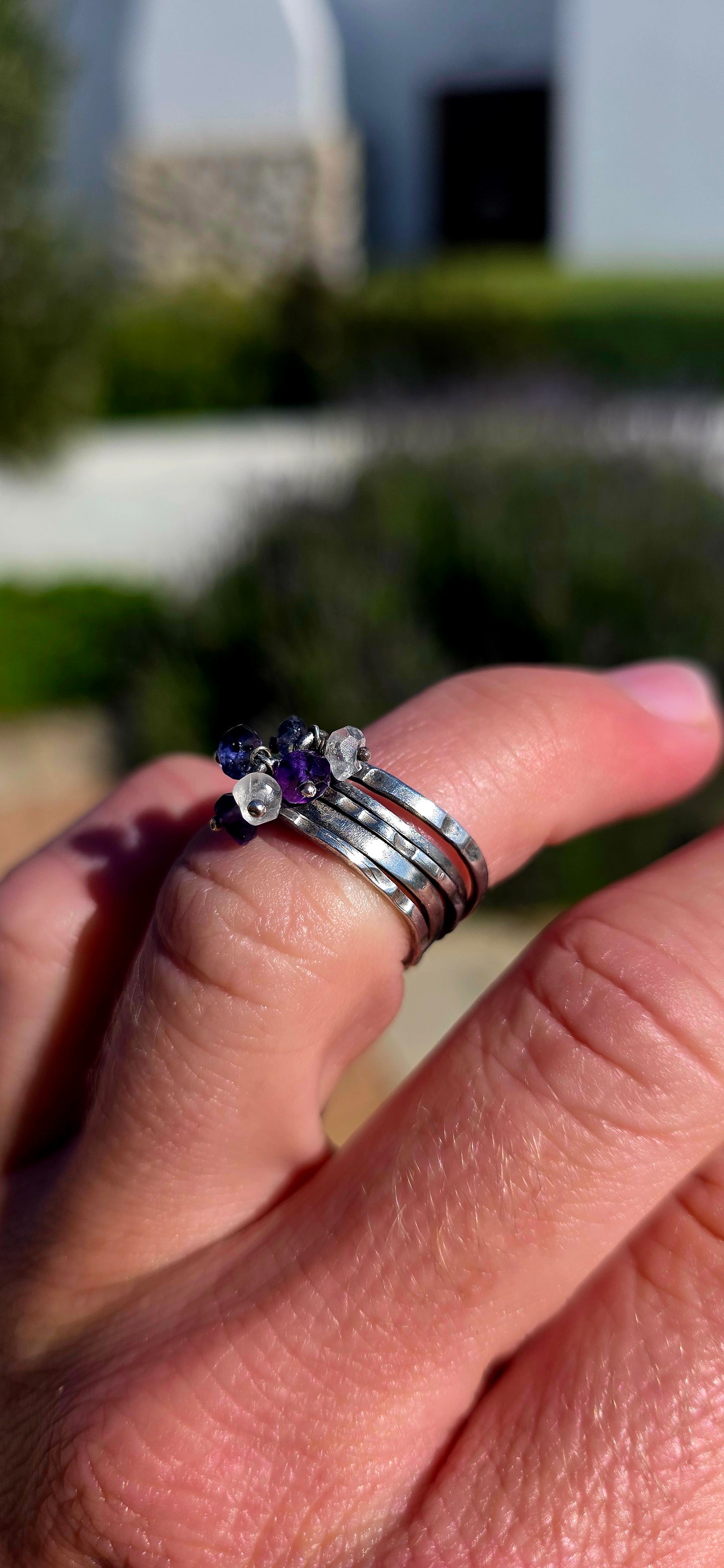 A beautifully handcrafted statement ring featuring five individual sterling silver bands, each finished with its own unique texture and character.