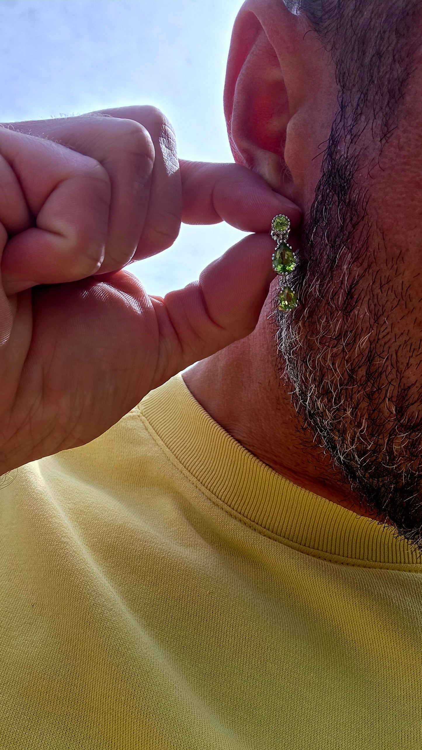 Fresh, vibrant, and full of graceful movement... these elegant sterling silver drop earrings celebrate the captivating beauty of natural peridot.