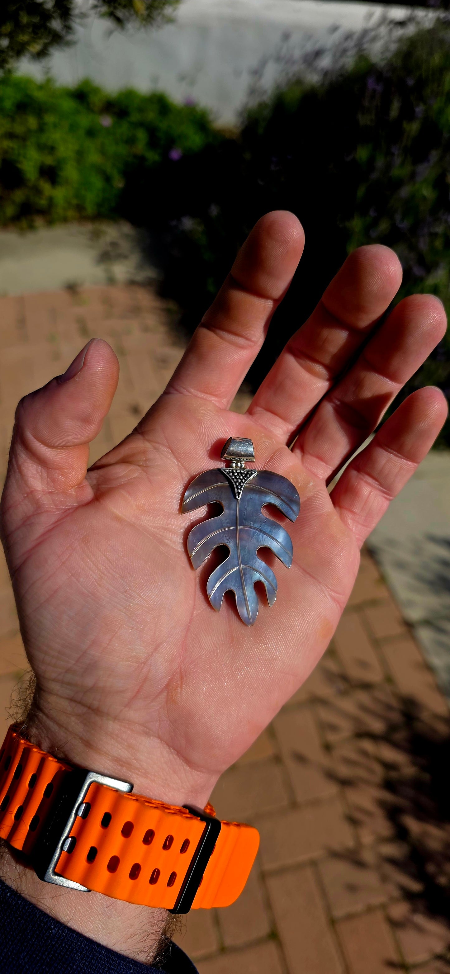 Nature has long inspired some of the world's most beautiful jewellery, and this generously sized hand-carved Mother of Pearl pendant is a perfect example.