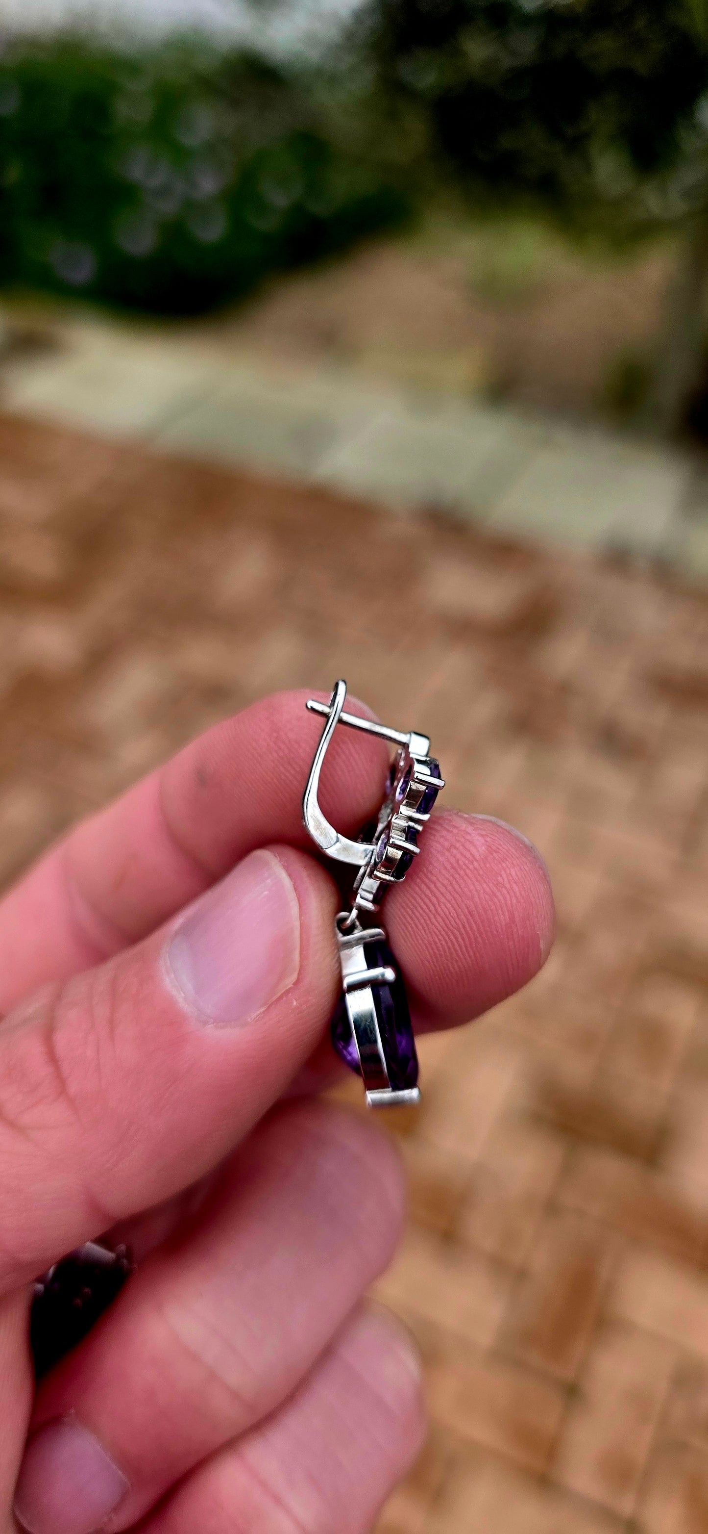 Enchanting, feminine, and absolutely drenched in purple sparkle... these beautiful sterling silver and amethyst drop earrings have the most wonderful floral design, almost resembling a pair of jewelled orchids.