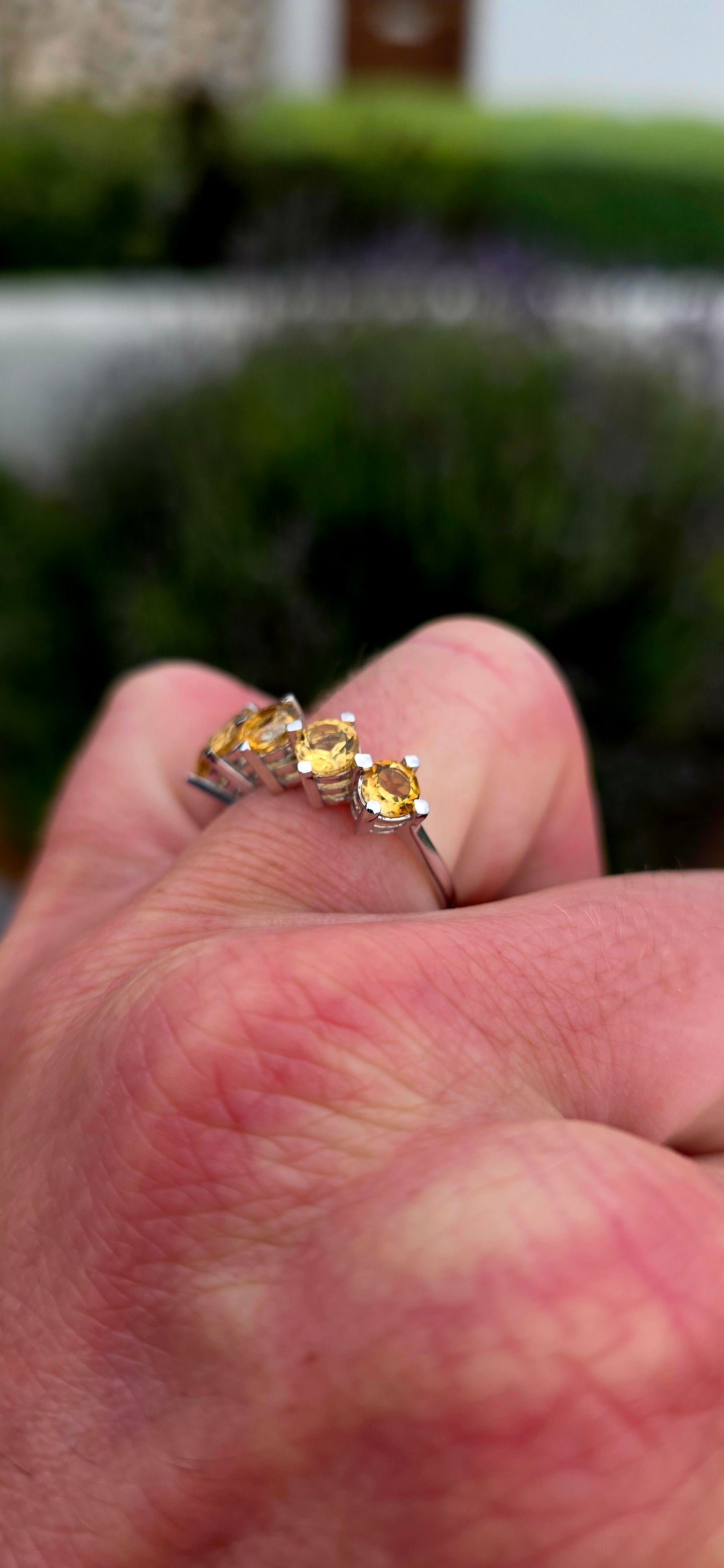Bright, elegant and wonderfully easy to wear... this beautiful sterling silver half eternity ring features a glowing row of five natural citrine gemstones, bringing the most gorgeous little burst of golden sunshine to the finger.