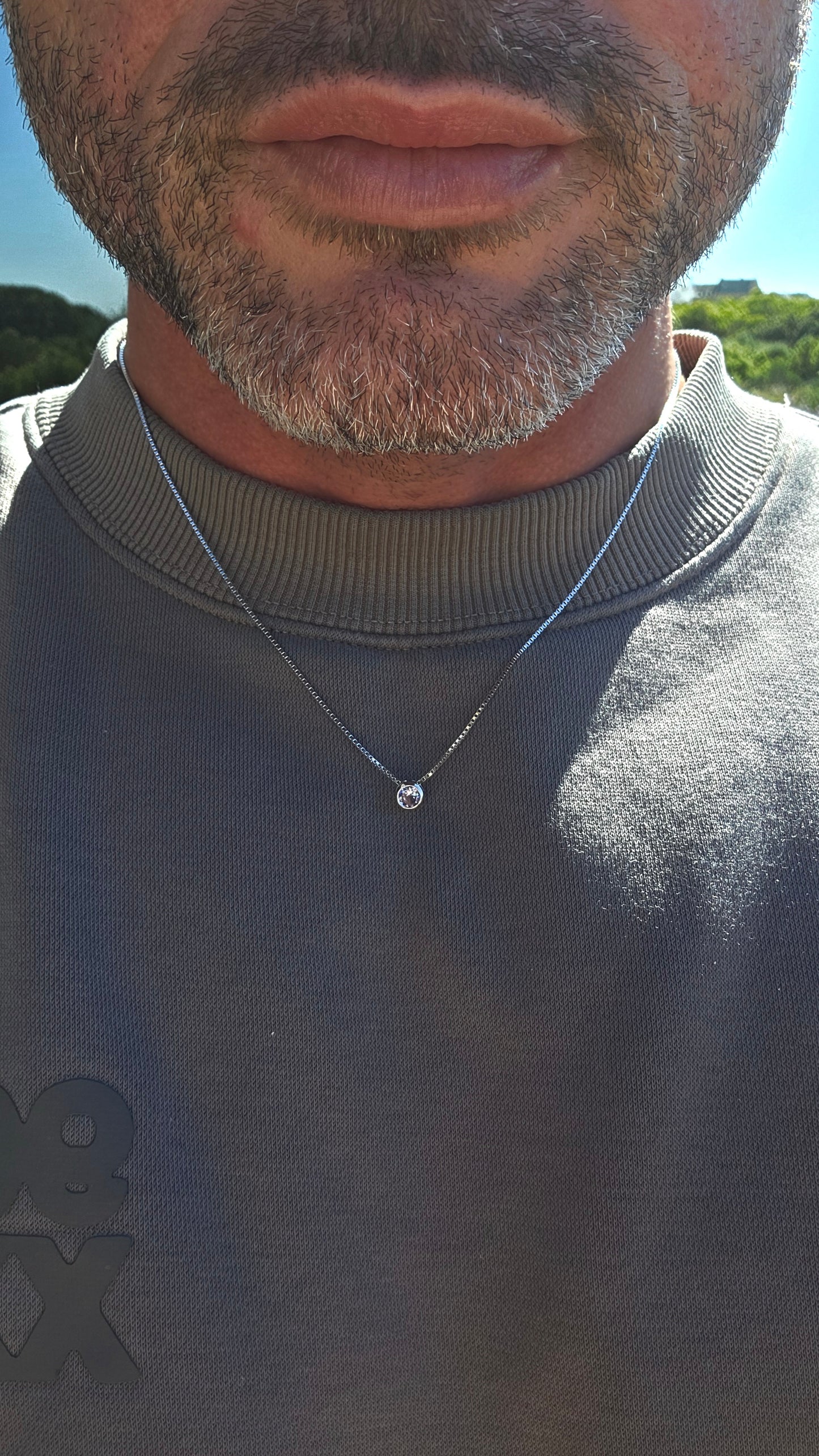 Minimalistic, timeless and beautifully UNISEX — this sterling silver necklace is proof that understated elegance never goes out of style.
Suspended from a fine sterling silver box-link chain is a single round-cut natural tanzanite.
