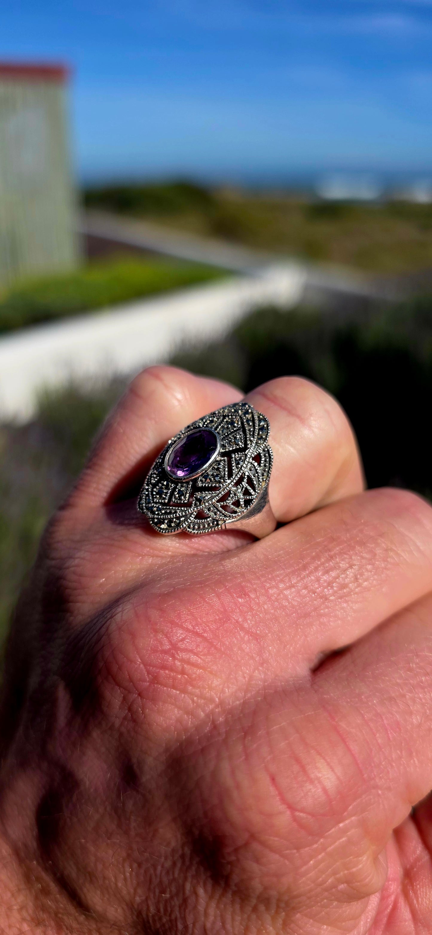 Bold, architectural and fabulously glamorous! This chunky Art Deco Revival dress ring is crafted in solid sterling silver and features an elongated statement face with intricate pierced filigree-style openwork.