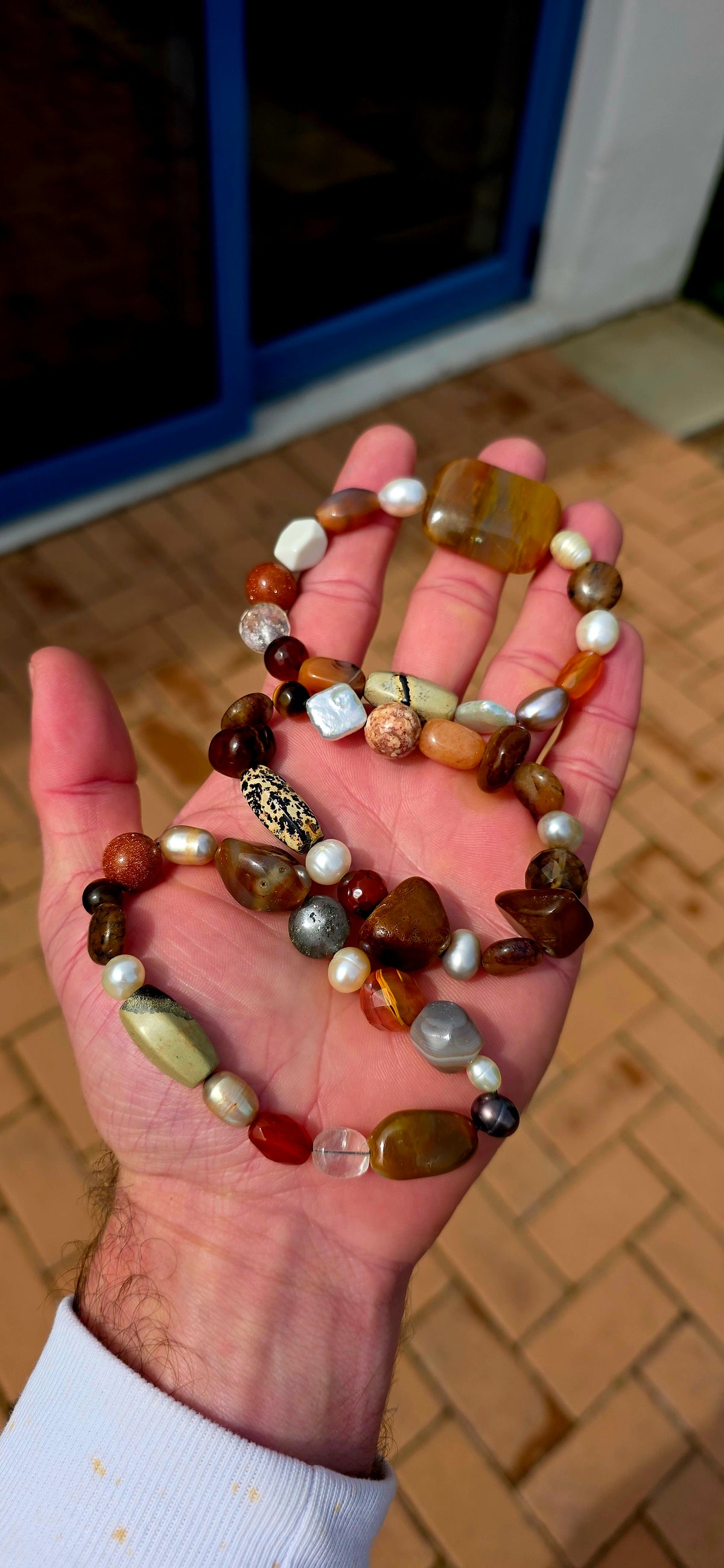 What an absolutely GORGEOUS earthy trio! The trio consists of three individual stretch bracelets, each strung with an eclectic mixture of natural gemstones and freshwater pearls in beautifully warm, organic tones.