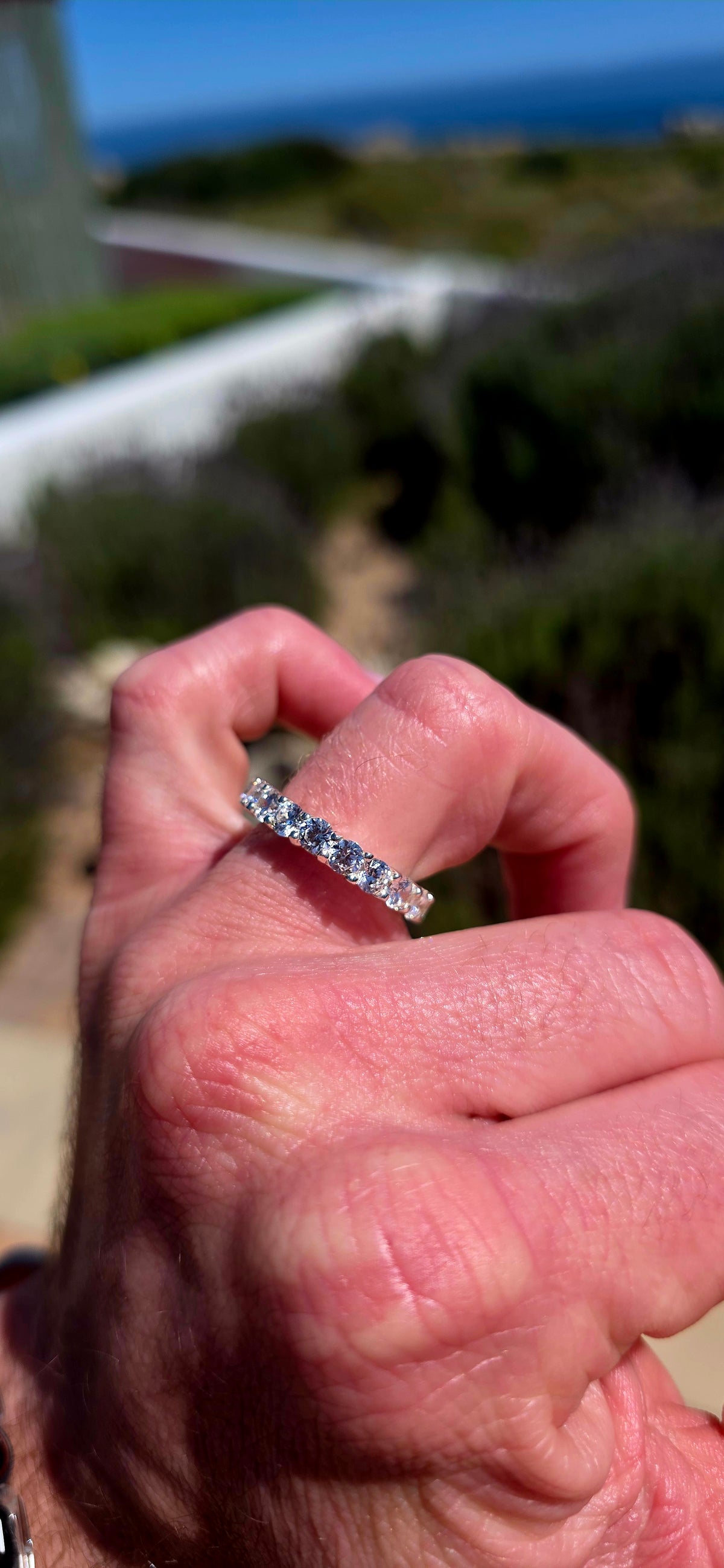 A fabulous sterling silver full eternity stacking ring, completely encircled by 19 ultra-sparkly round-cut AAA Swiss-grade CZ gemstones.