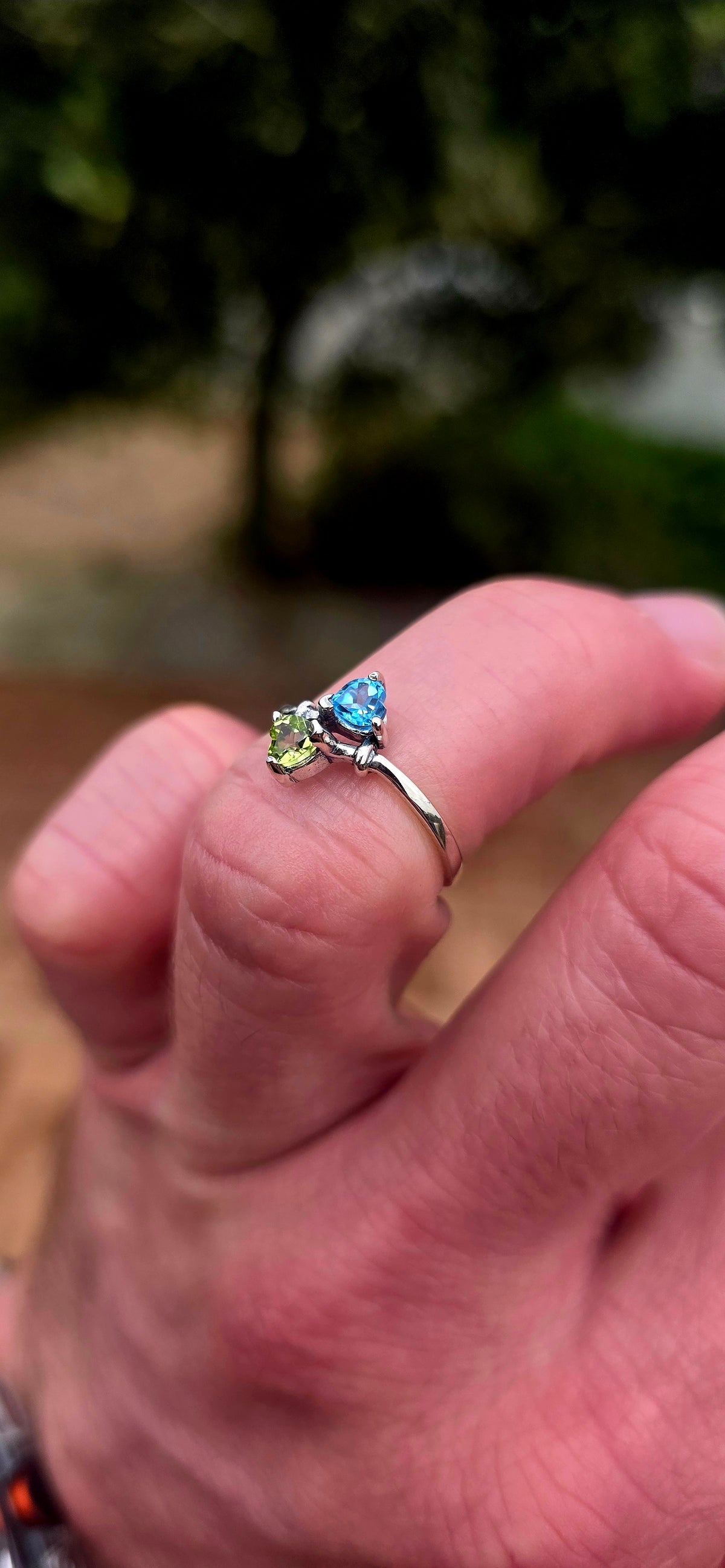 A beautifully dainty and feminine sterling silver Toi et Moi bypass ring, featuring two gorgeous fancy heart-cut gemstones nestled together in a wonderfully romantic design!