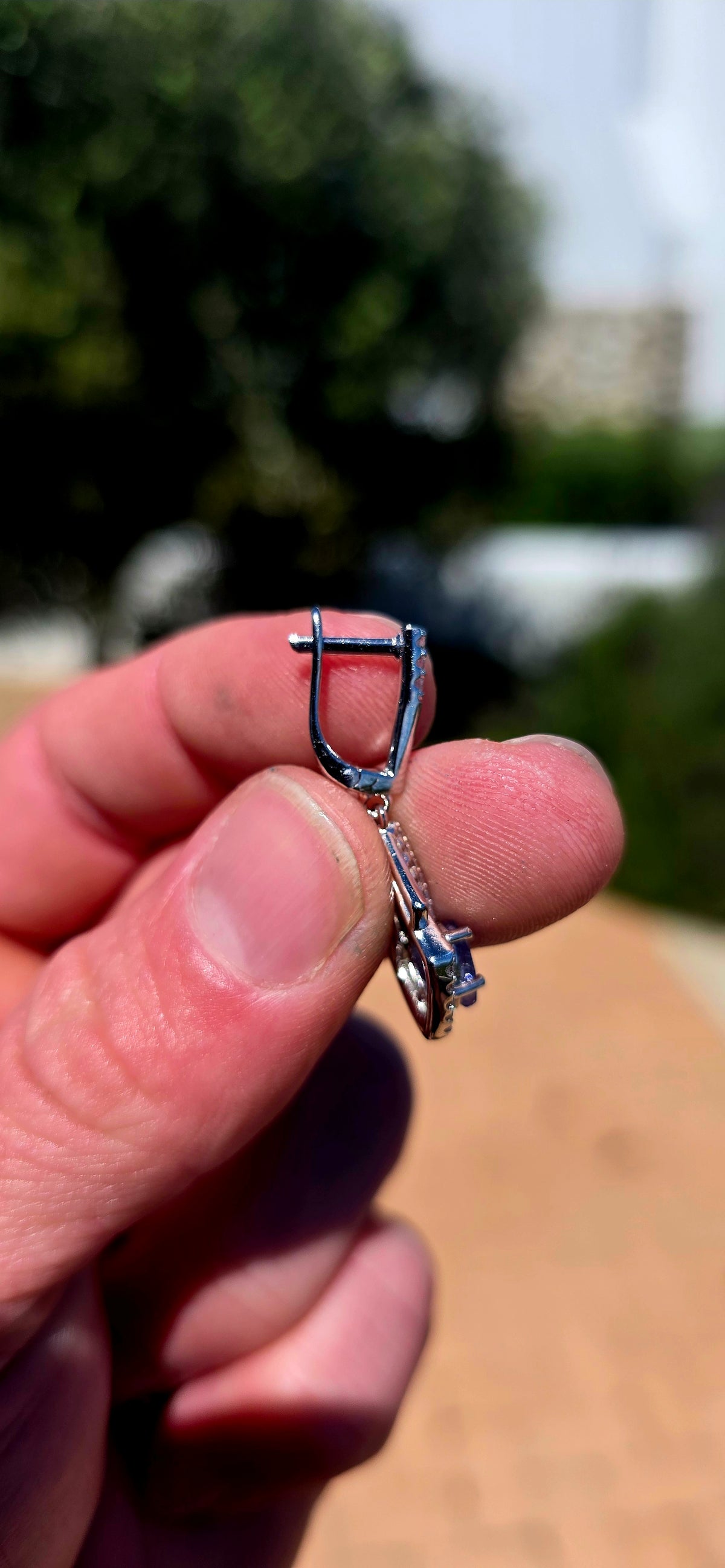 A beautifully elegant pair of Art Deco revival sterling silver drop earrings, featuring enchanting violet-blue tanzanites complemented by sparkling cubic zirconia gemstones!