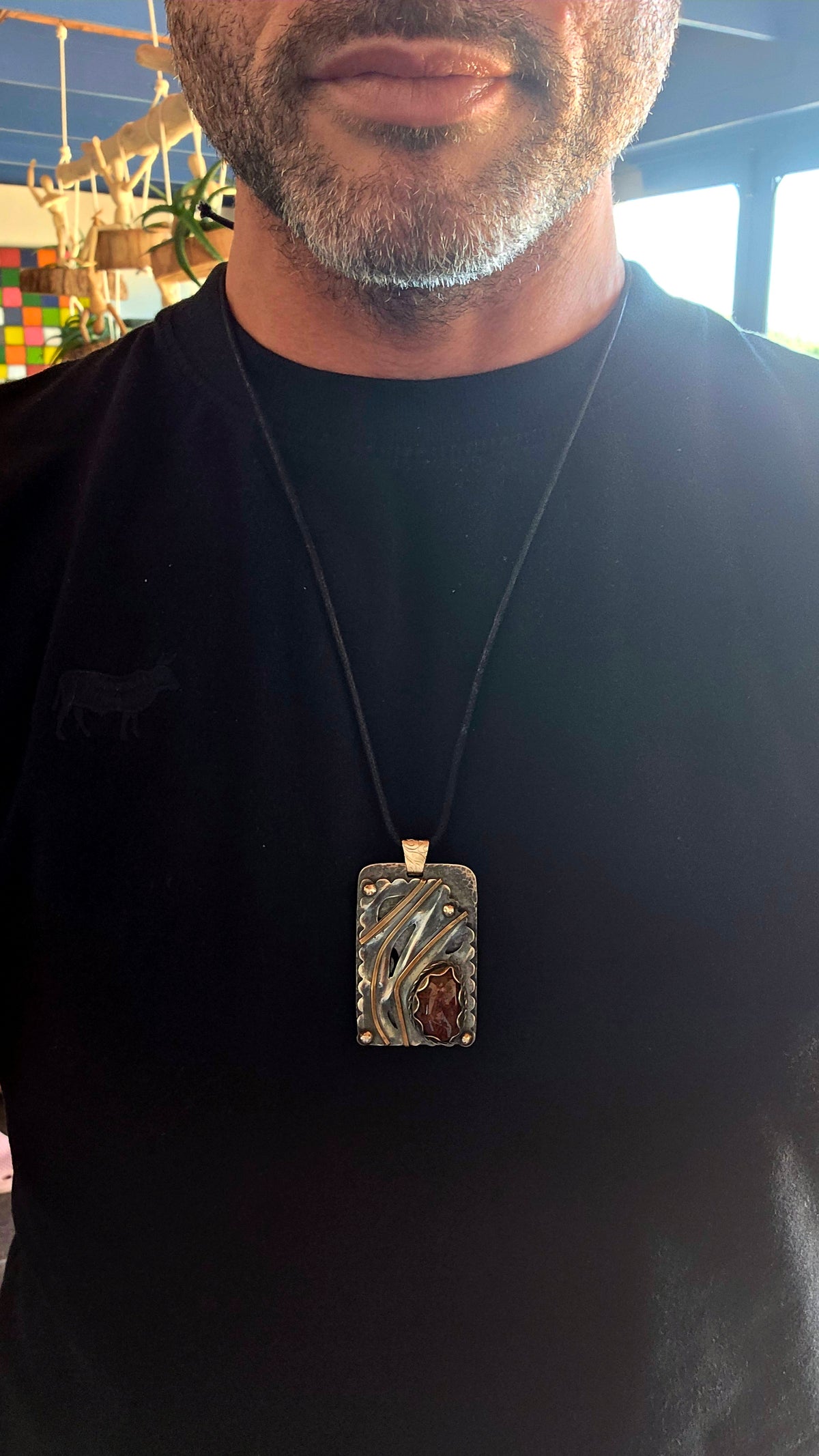 A spectacular oversized, handcrafted sterling silver statement pendant combining architectural design, contrasting metals and the beautiful earthy character of natural agate.