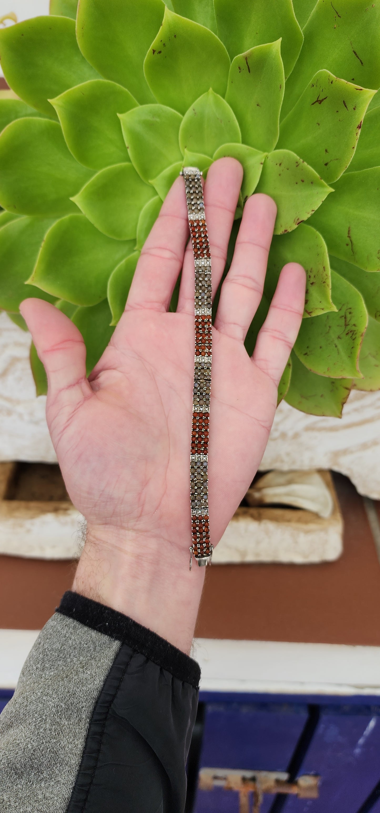 Sterling Silver Tennis bracelet set with multiple Moonstone and Carnelian Cabochons and Clear CZ Gemstones - Fitted with double safety latches .