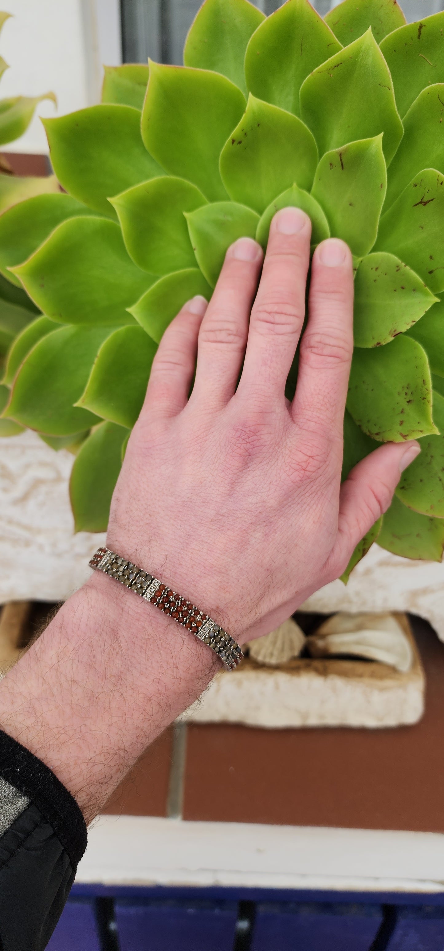 Sterling Silver Tennis bracelet set with multiple Moonstone and Carnelian Cabochons and Clear CZ Gemstones - Fitted with double safety latches .