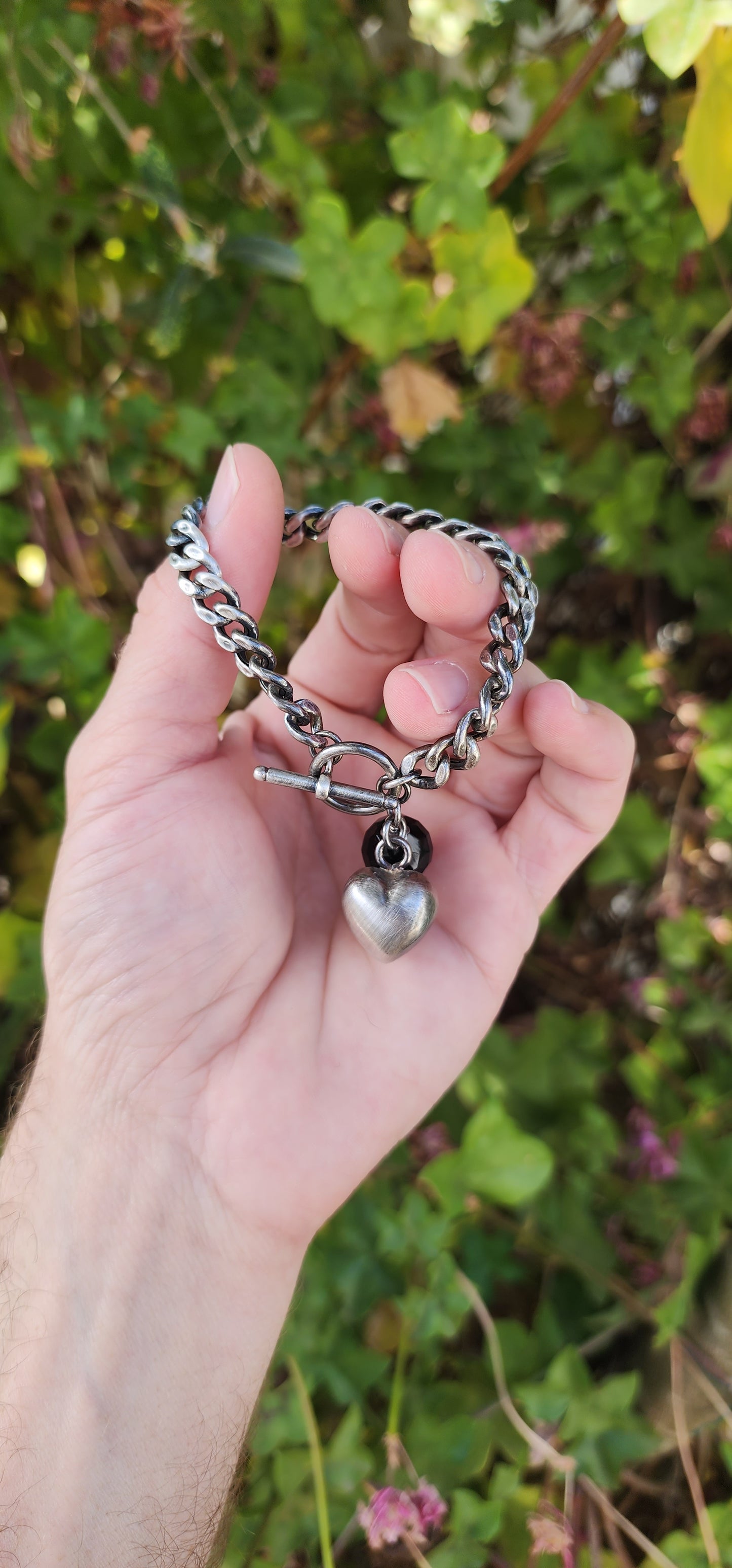 Vintage style Oxidised Sterling Silver Cuban link bracelet with puffed Heart and Faceted Black Onyx Gemstone charms - Fitted with an Toggle clasp.