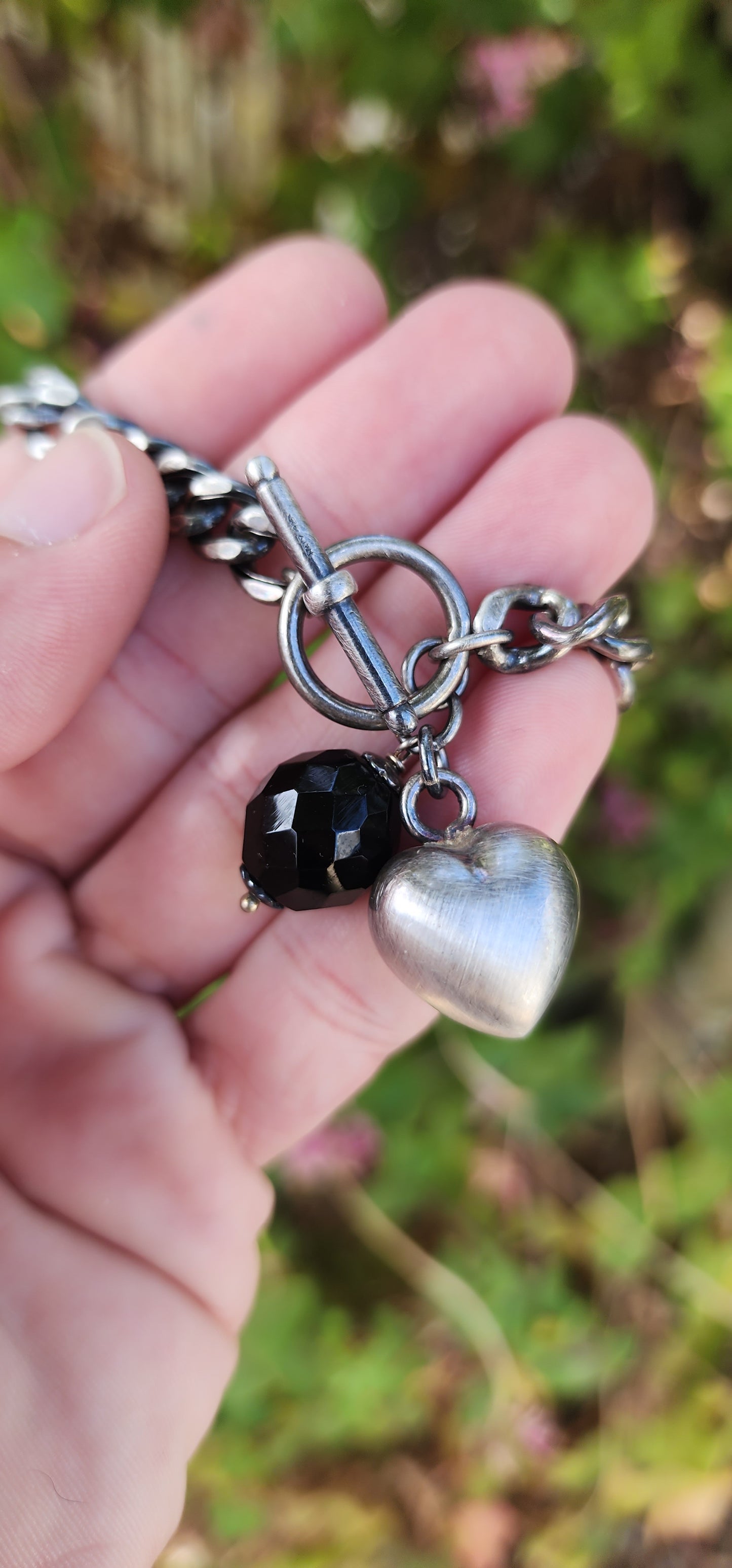 Vintage style Oxidised Sterling Silver Cuban link bracelet with puffed Heart and Faceted Black Onyx Gemstone charms - Fitted with an Toggle clasp.