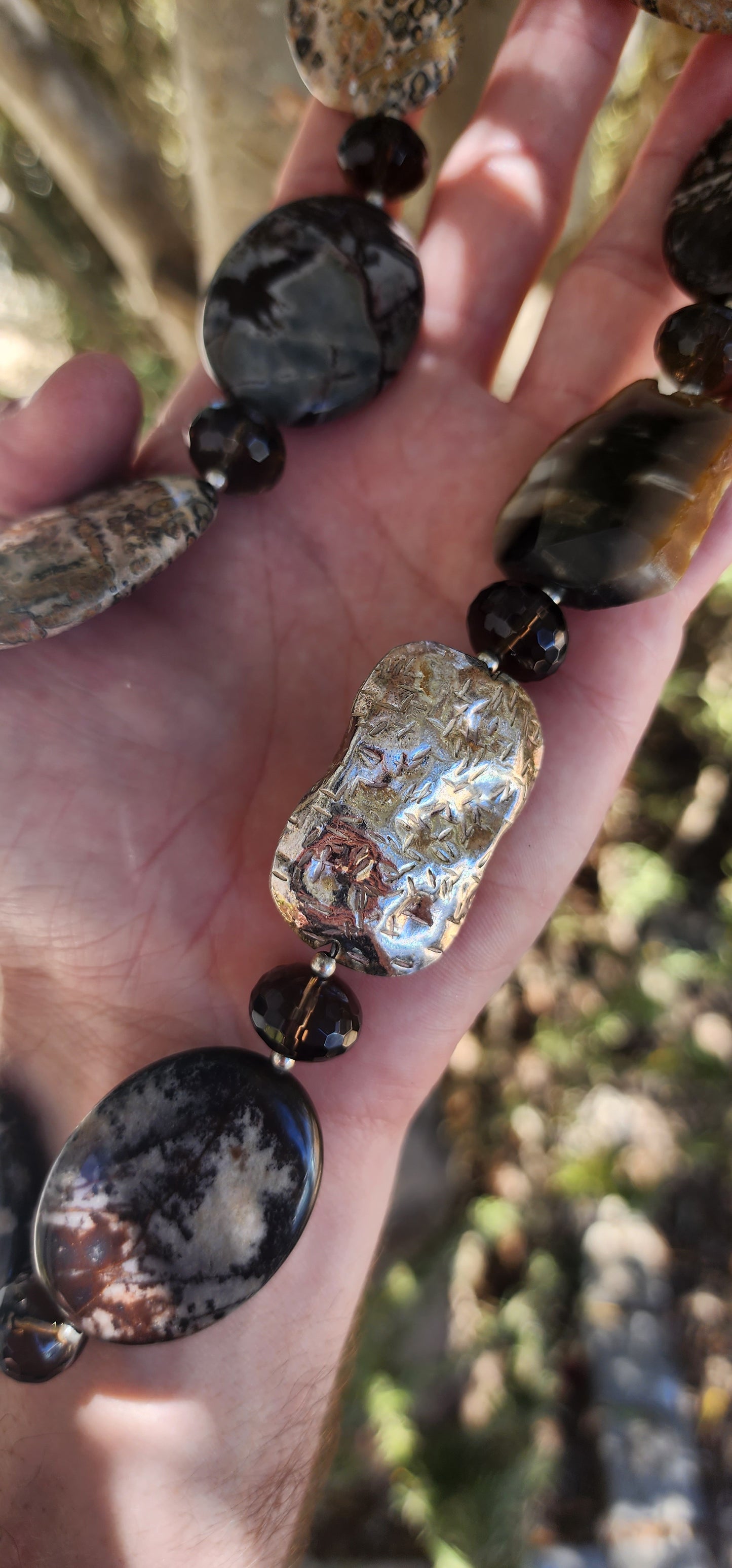 Designer Necklace consisting out of an collection of Agate,Smokey Quartz and Sterlings Silver beads.