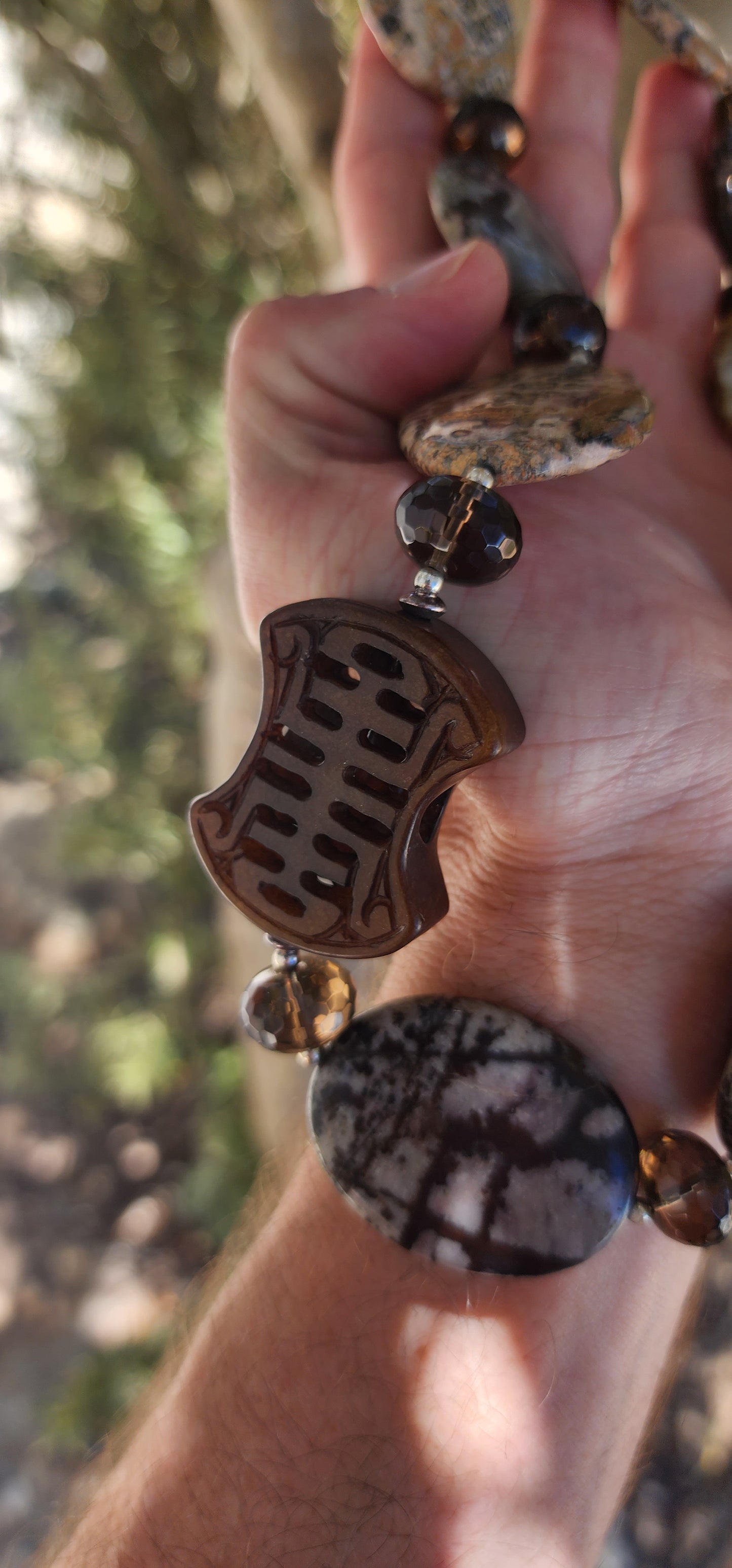 Designer Necklace consisting out of an collection of Agate,Smokey Quartz and Sterlings Silver beads.