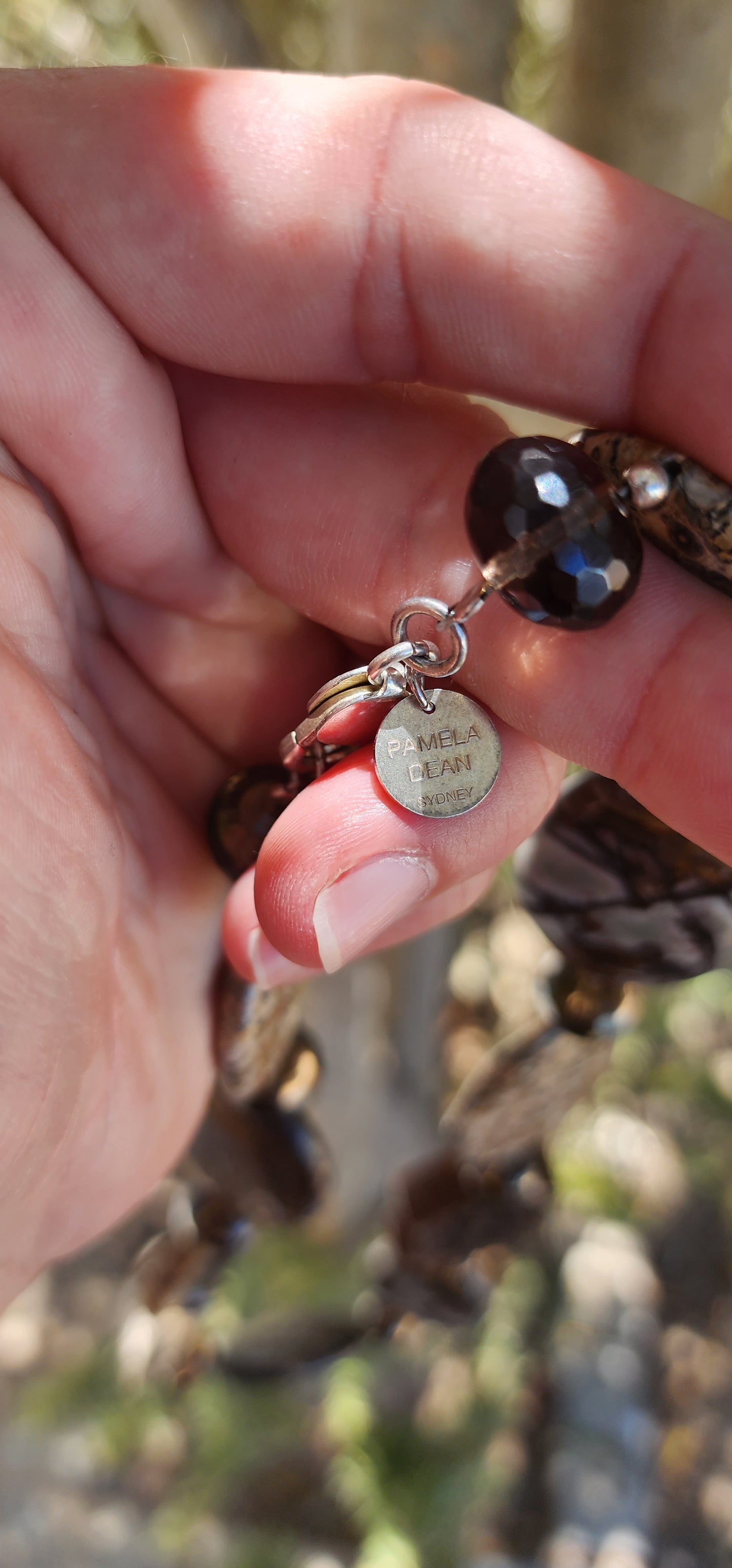 Designer Necklace consisting out of an collection of Agate,Smokey Quartz and Sterlings Silver beads.