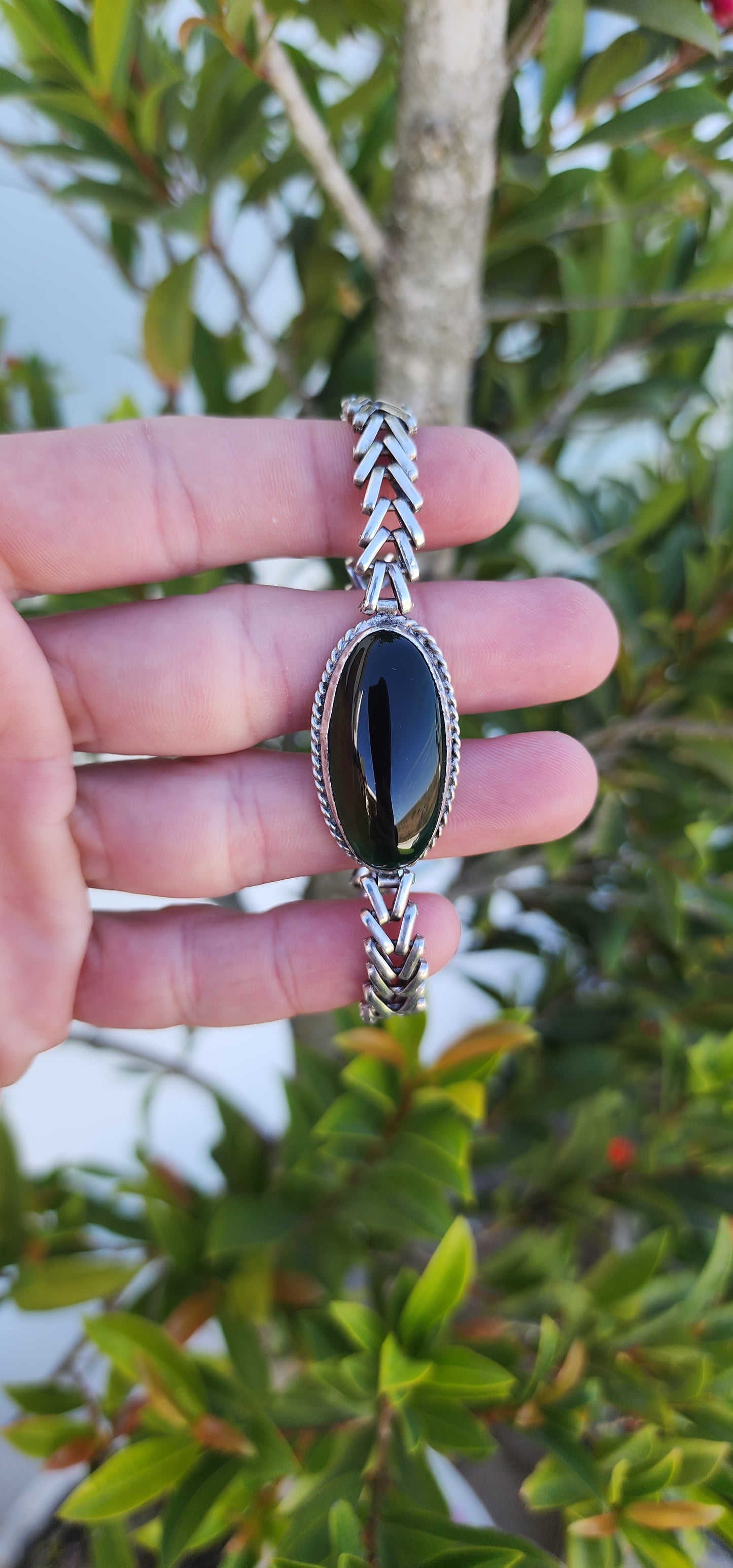 Sterling Silver Chevron style link bracelet set with an beautiful dark Greenish/Brown Serpentine Cabochon.