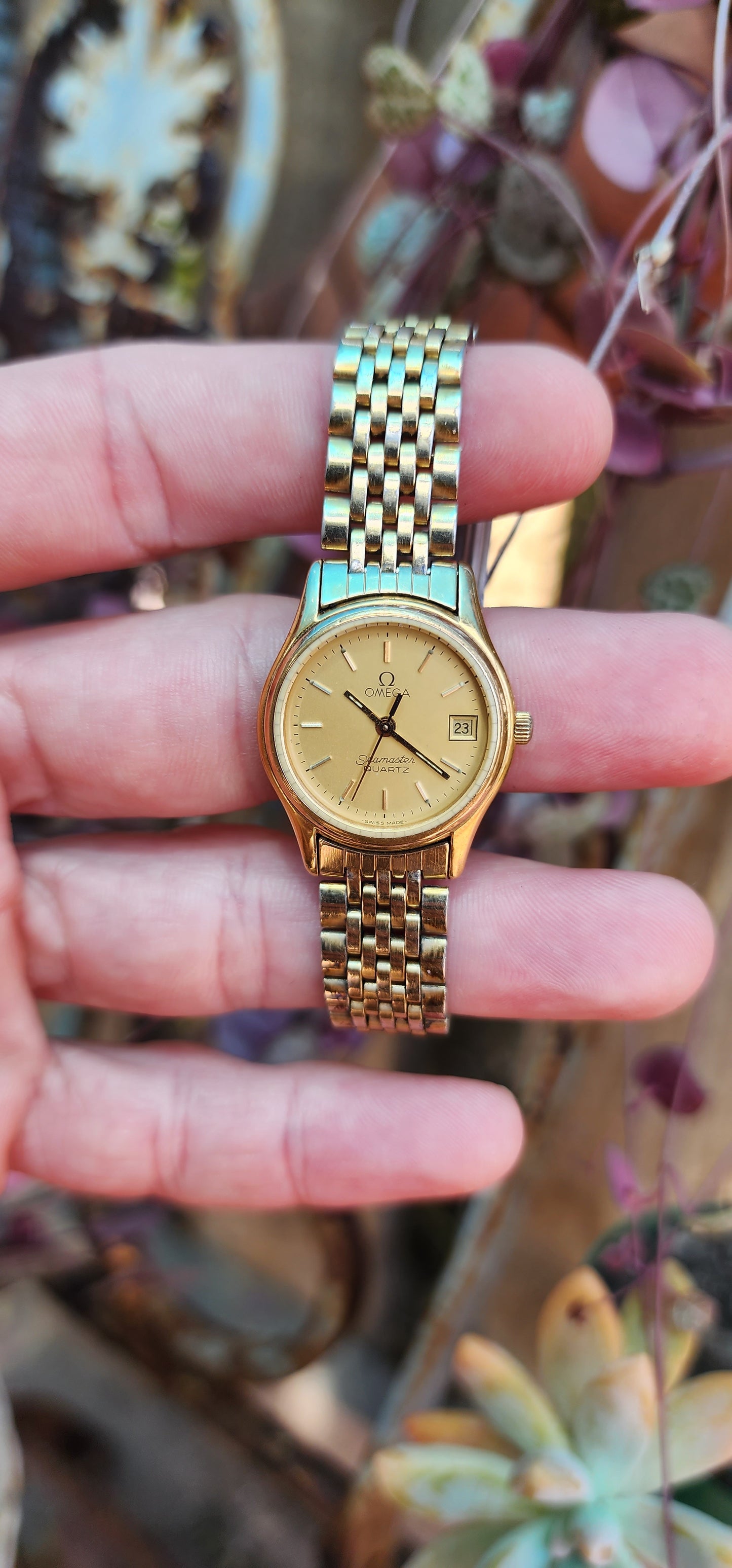 Vintage circa 1983 ladies Yellow Gold plated Omega Seamaster Quartz watch with original Gold Plated strap.