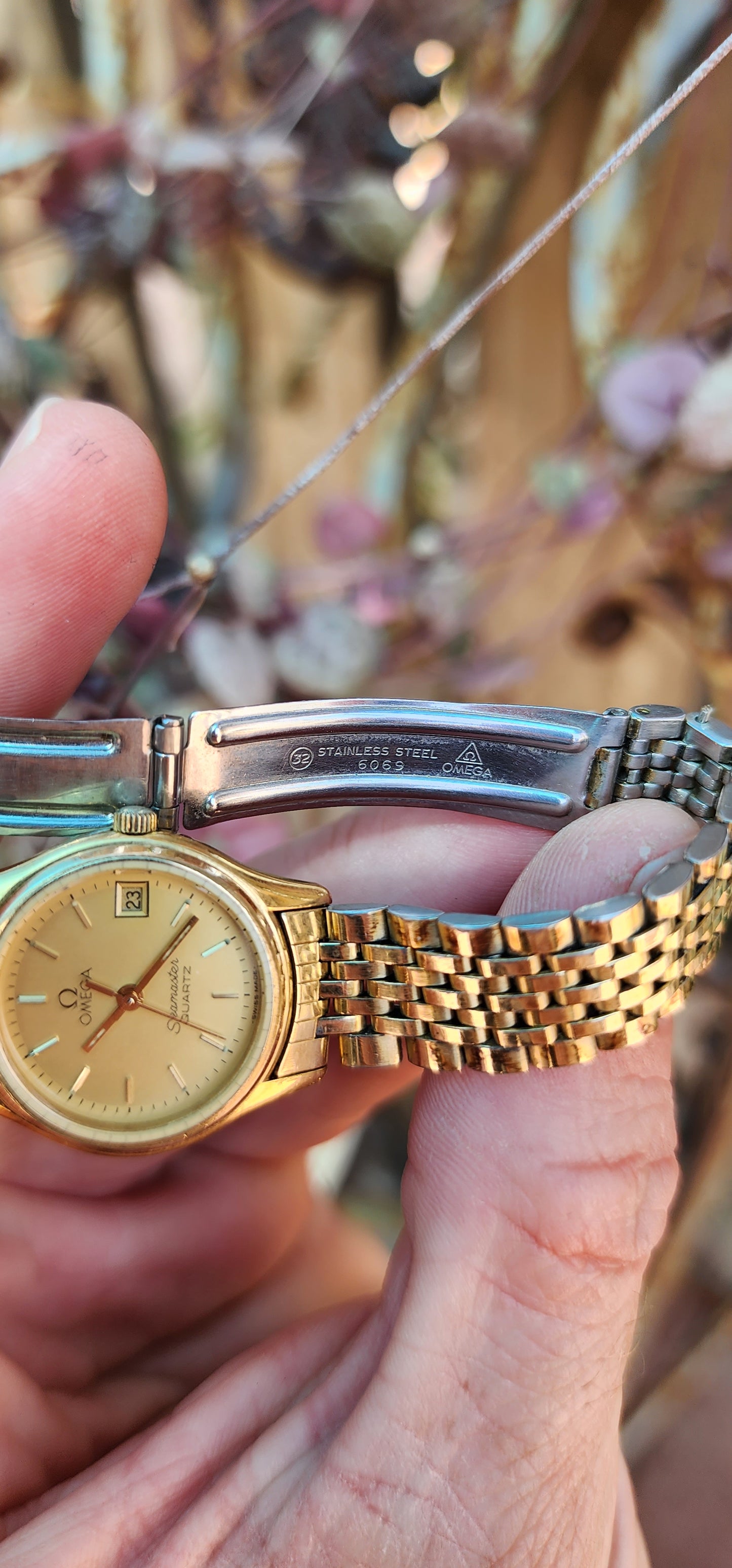 Vintage circa 1983 ladies Yellow Gold plated Omega Seamaster Quartz watch with original Gold Plated strap.