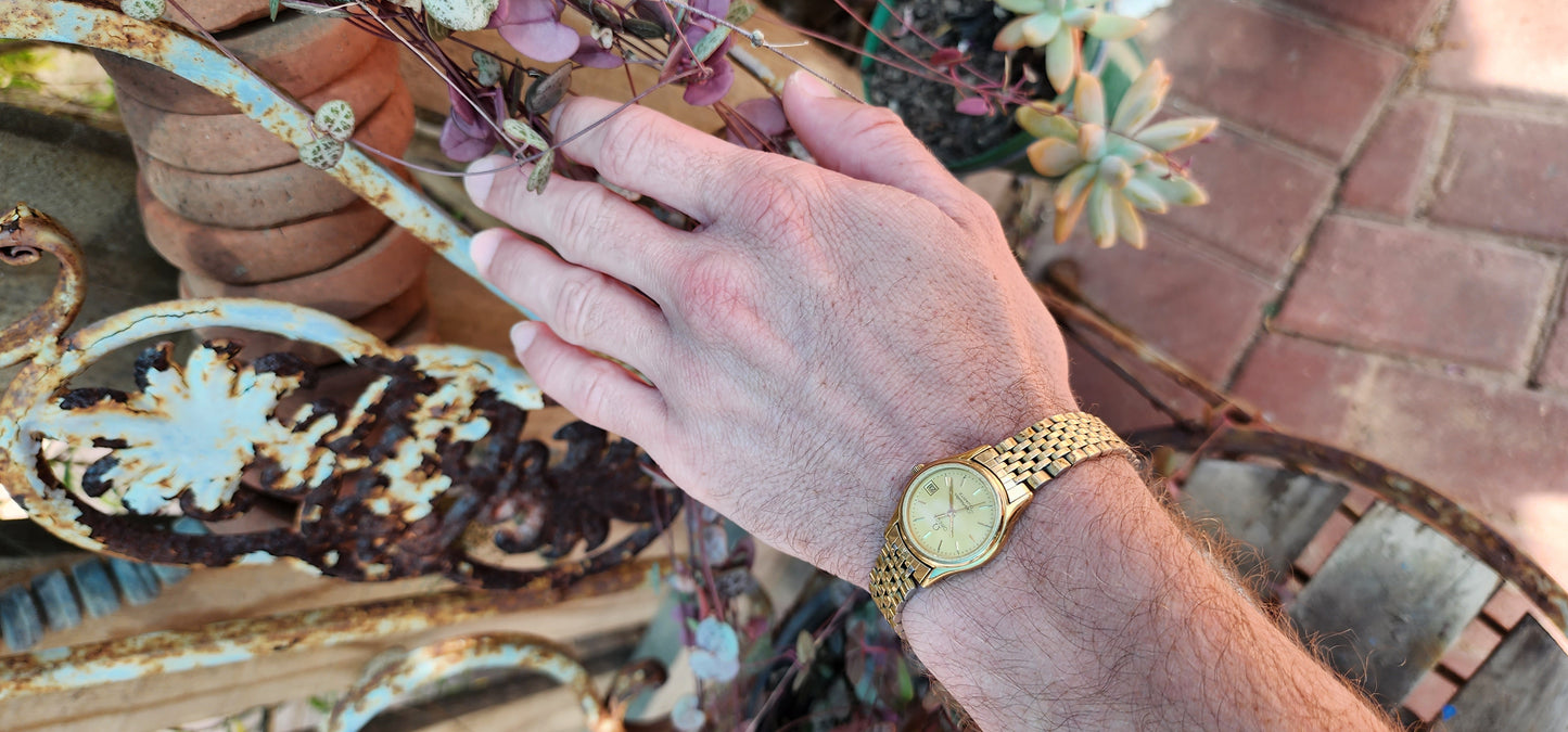 Vintage circa 1983 ladies Yellow Gold plated Omega Seamaster Quartz watch with original Gold Plated strap.