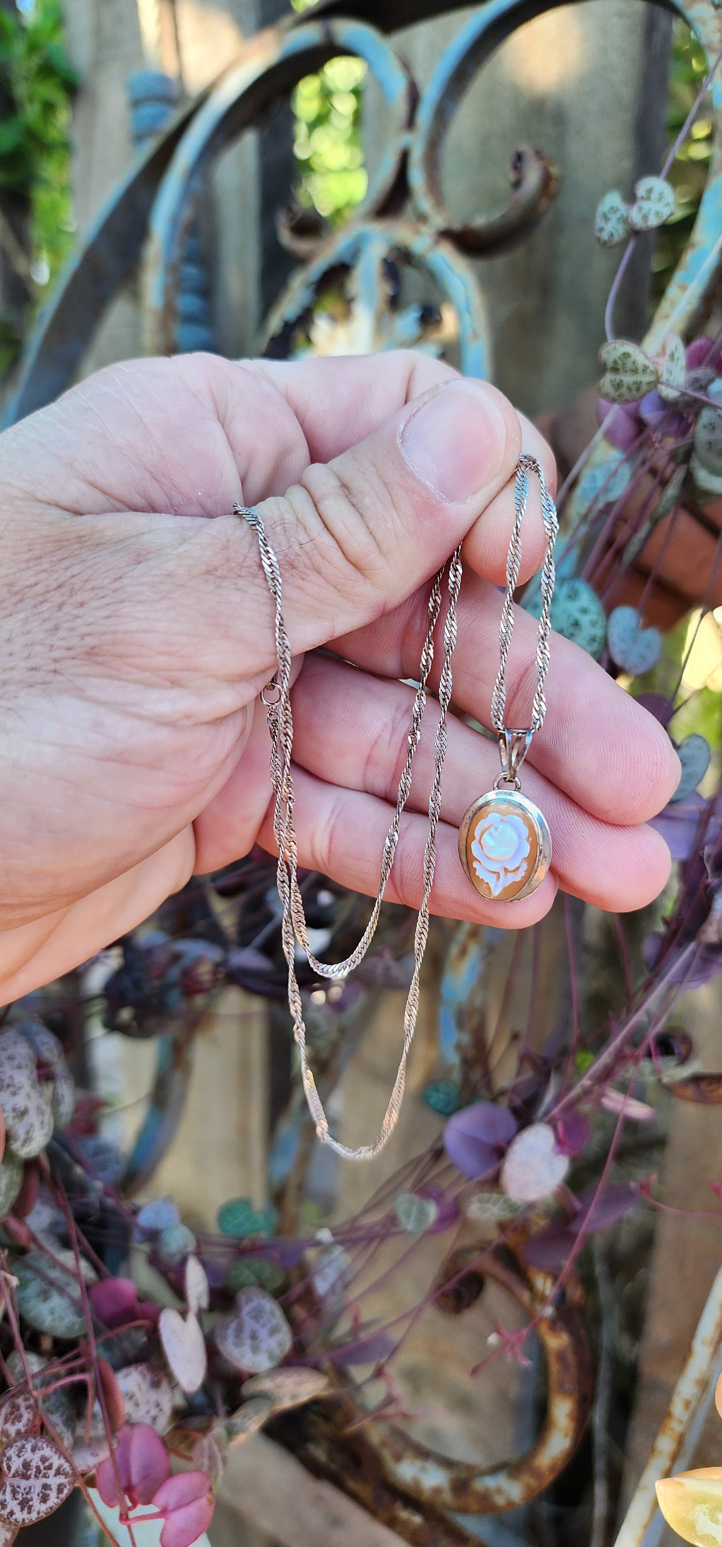 Vintage Sterling Silver and hand carved Rose Cameo Shell pendant - Fitted on an Sterling Silver chain .