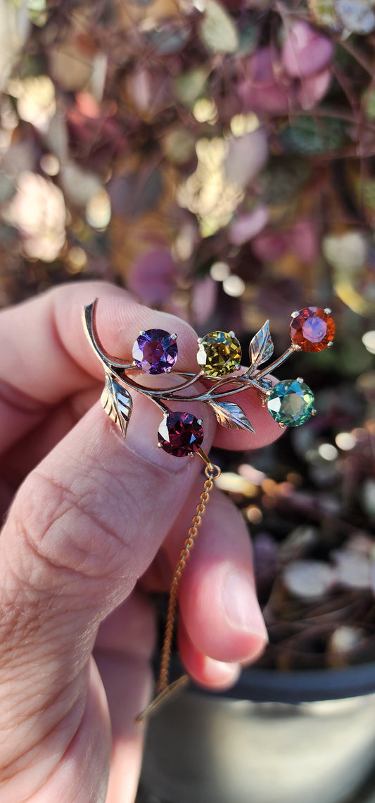 Beautiful Antique Victorian era (1837 – 1901) 9ct Rose Gold flower and leaf design Harlequin spray brooch consisting of Natural multi-colour Gemstones