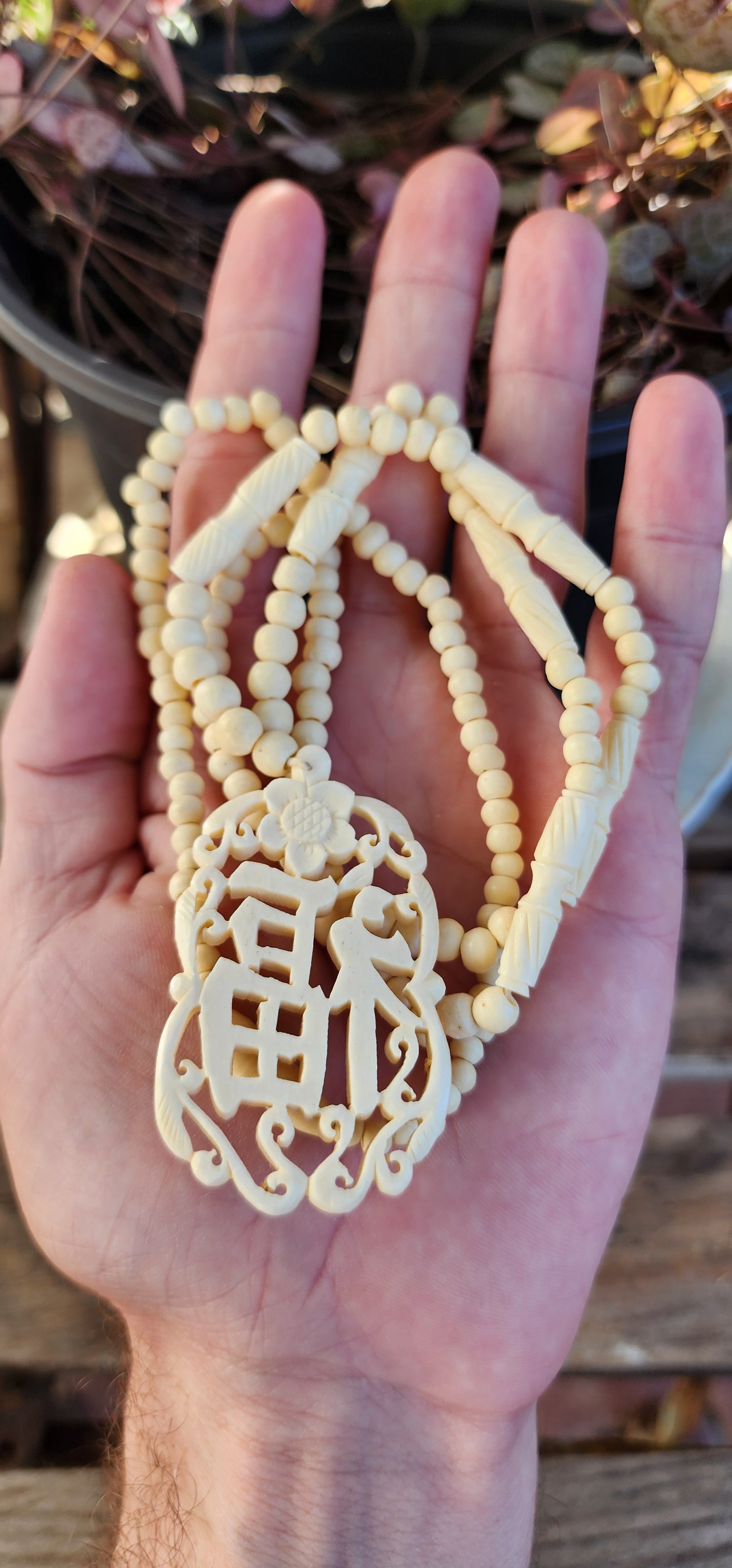 Vintage Chinese necklace features a beautifully Ox Bone carved "Good Fortune" symbol pendant with hand-carved beads.