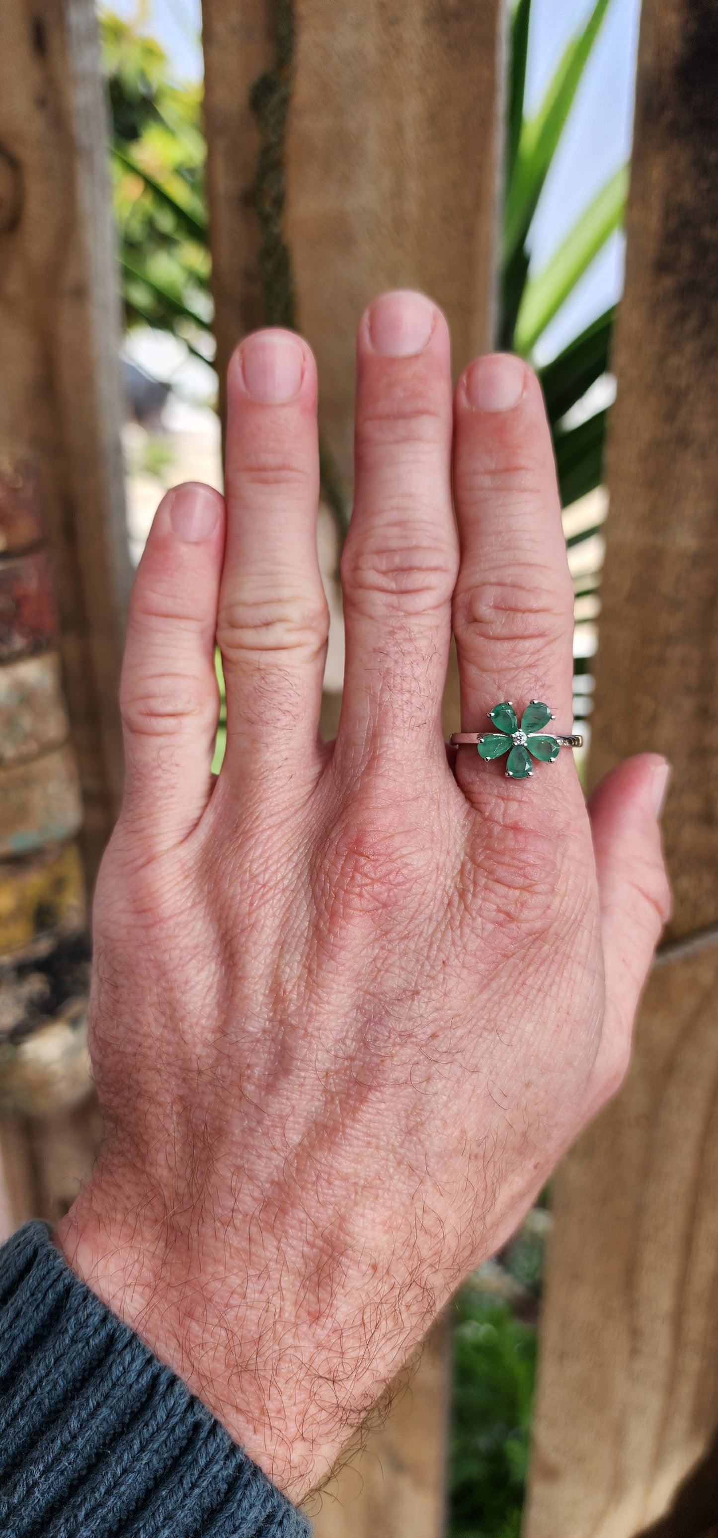 Attractive Sterling Silver ,Natural Emeralds and clear CZ Floral dress ring.