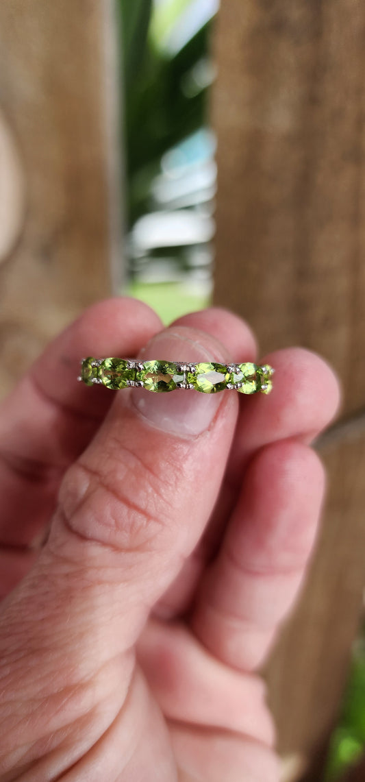 Sterling Silver and Faceted Oval cut Green Peridot  Full Eternity ring.