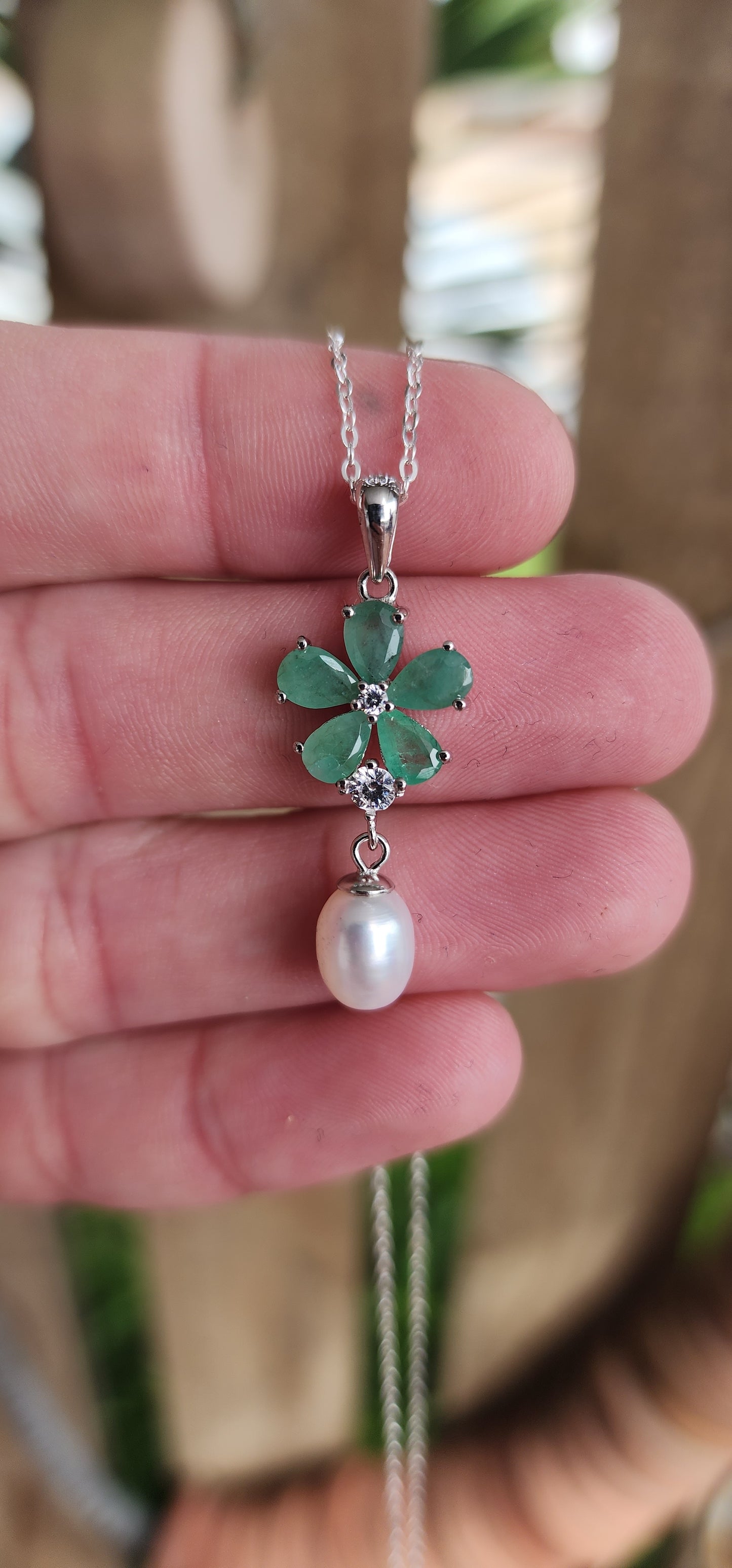 Attractive Sterling Silver ,Natural Emeralds,clear CZ Gemstones and Freshwater Pearl pendant on Sterling Silver chain.