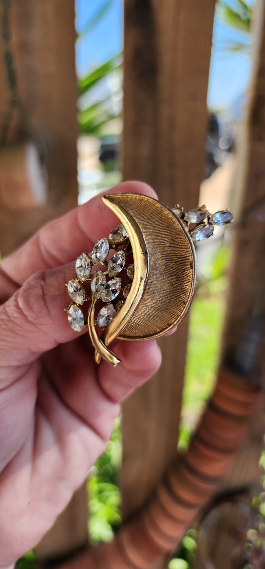 Vintage circa 1960's Designer Costume leaf brooch.Brushed Goldtone floral/leaf design set with sparkly Marquise cut Crystal Rhinestones .Made by Hollywood and signed accordingly.