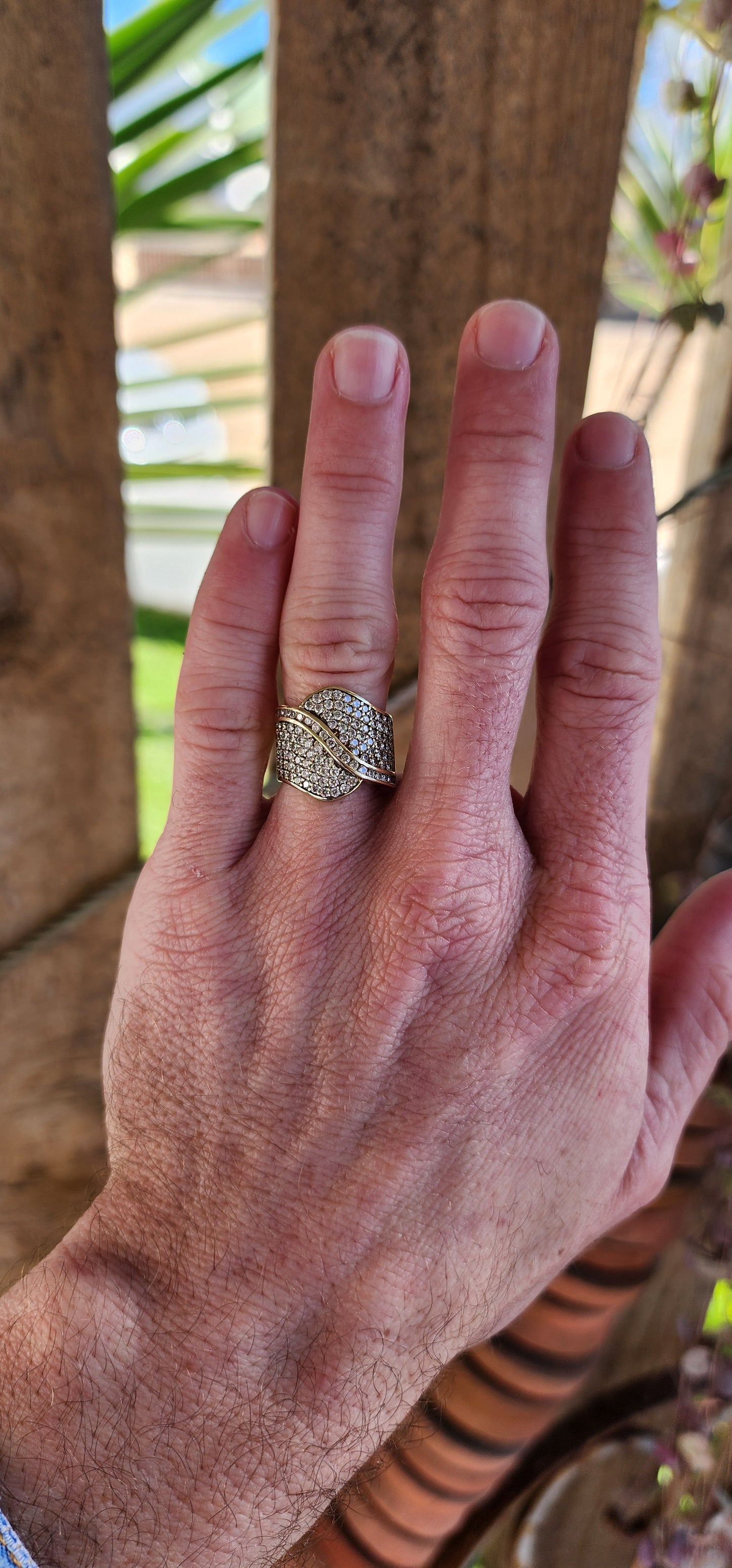 Gorgeous and wide Vintage 9ct Yellow Gold contemporary crossover design dress ring.Pavé and Channel set with multiple Round Cut CZ Gemstones that sparkle beautifully.