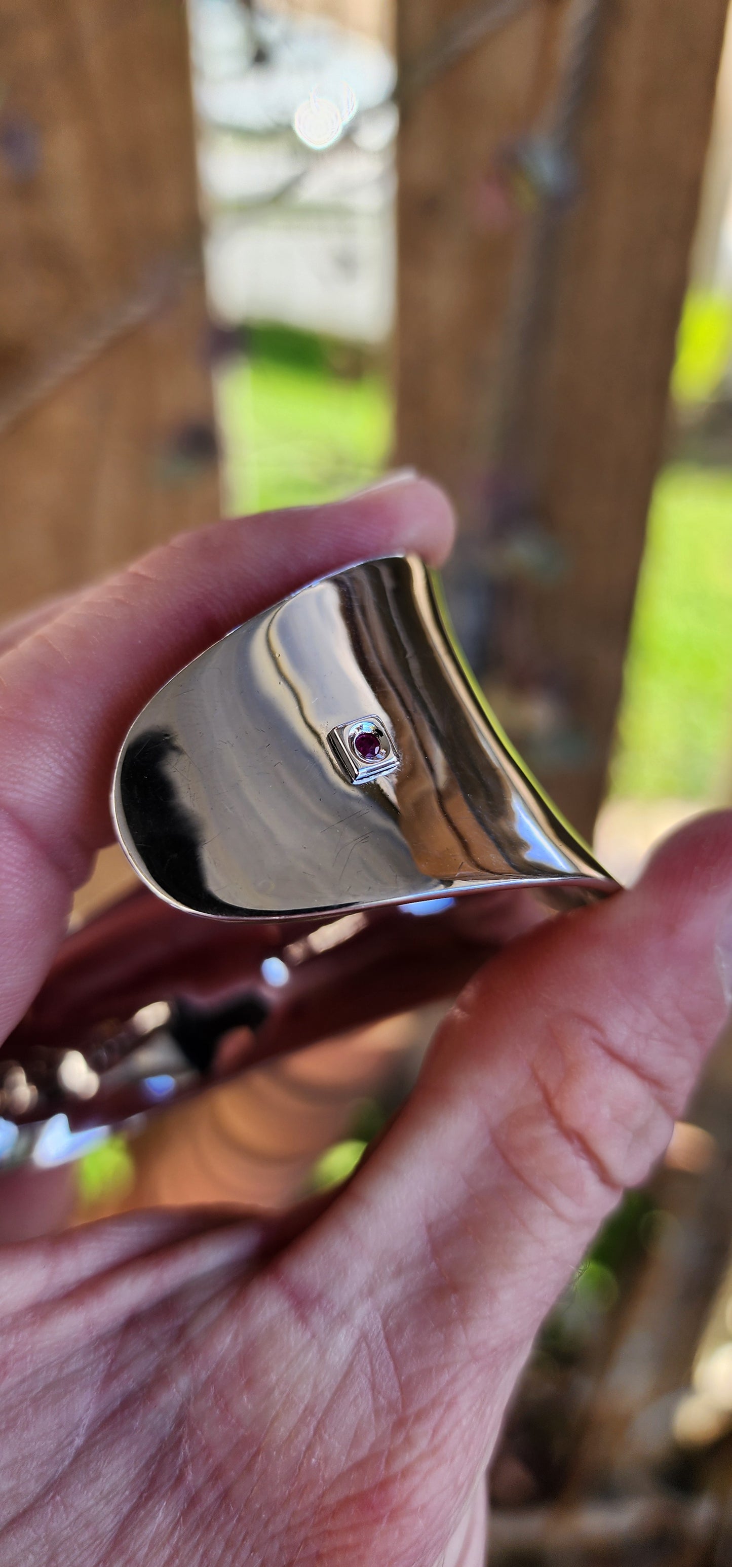 Chunky and weighty Designer Sterling Silver and Ruby Open Cuff STATEMENT bangle with an Modernist Wave design.Accented with an small Ruby at the back.Made by ELLE and signed accordingly.