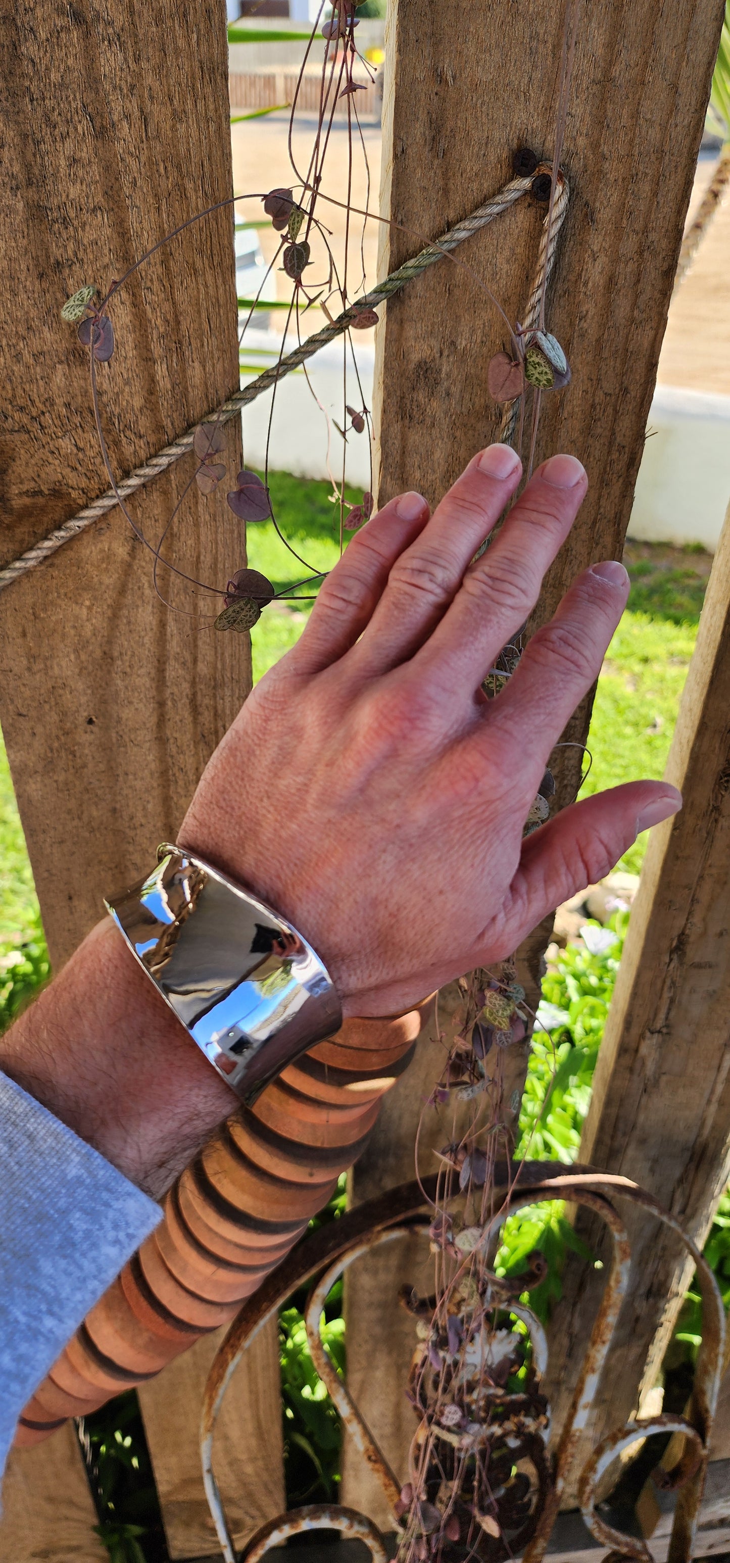 Chunky and weighty Designer Sterling Silver and Ruby Open Cuff STATEMENT bangle with an Modernist Wave design.Accented with an small Ruby at the back.Made by ELLE and signed accordingly.