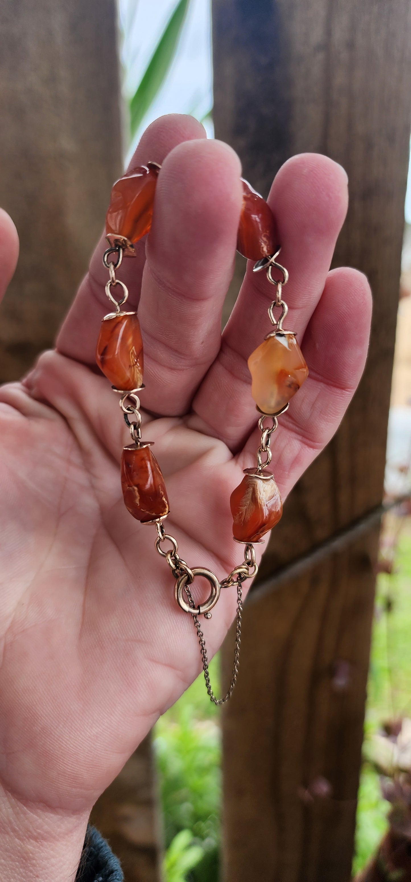 Exquisite Antique Victorian Era 9ct Rosy /Yellow Gold and Banded Carnelian(Agate) Gemstone beaded bracelet with safety chain .
The beads hand wrapped with 9ct Rosy/Yellow Gold wire and accented with 9ct Rose Gold discks at each end of the beads.